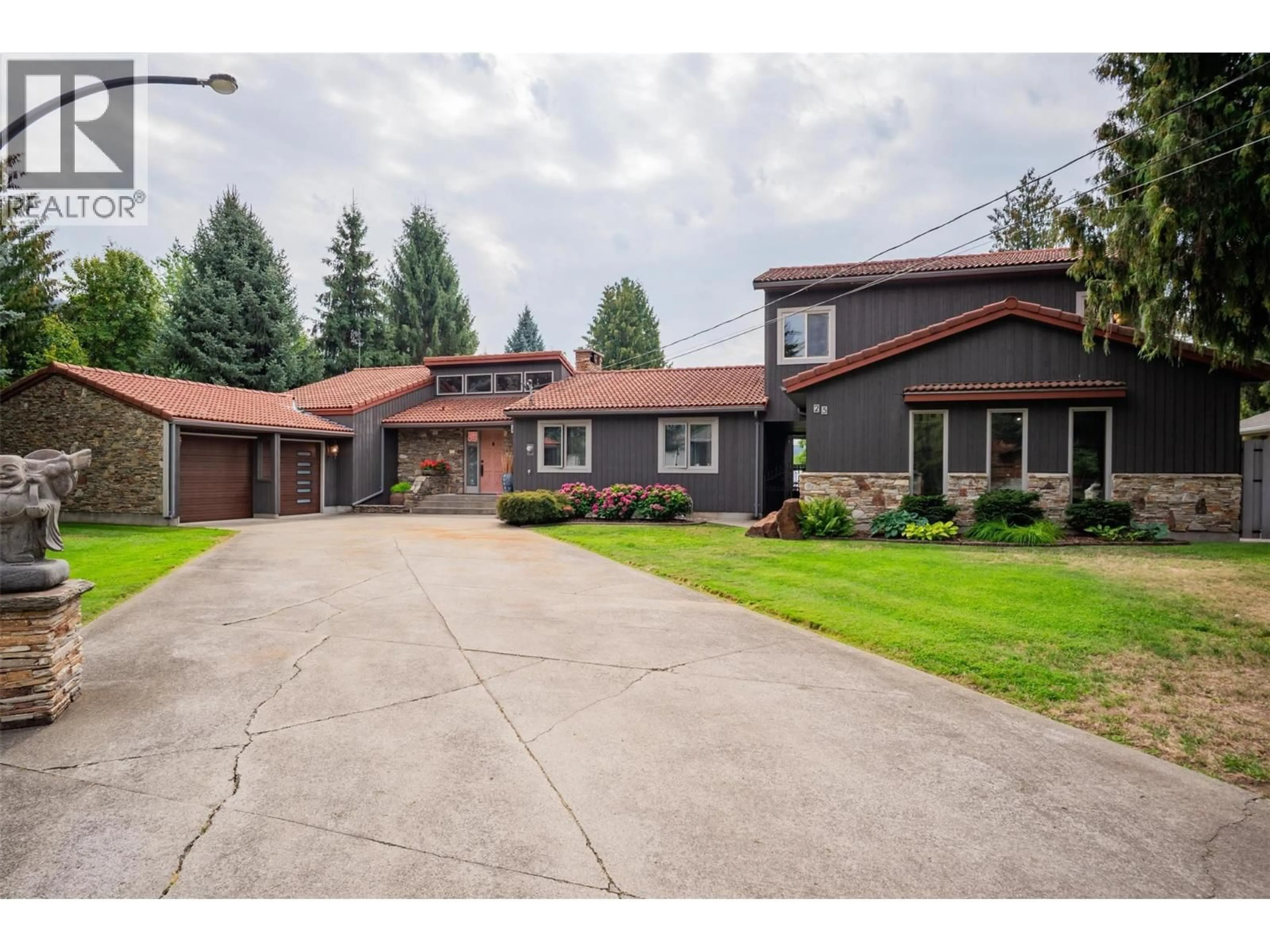 Home with brick exterior material, street for 25 WILSON ROAD, Christina Lake British Columbia V0H1E0