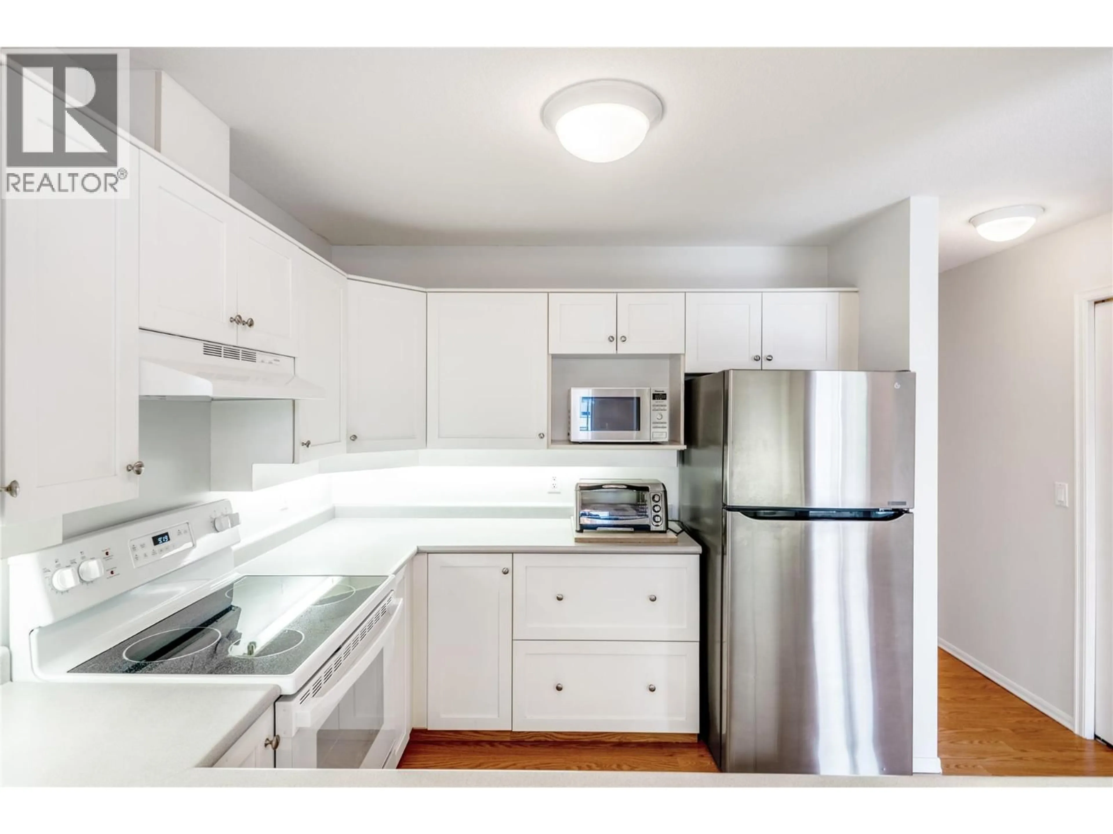 Standard kitchen, wood/laminate floor for 210 - 3283 CASORSO ROAD, Kelowna British Columbia V1W3L6