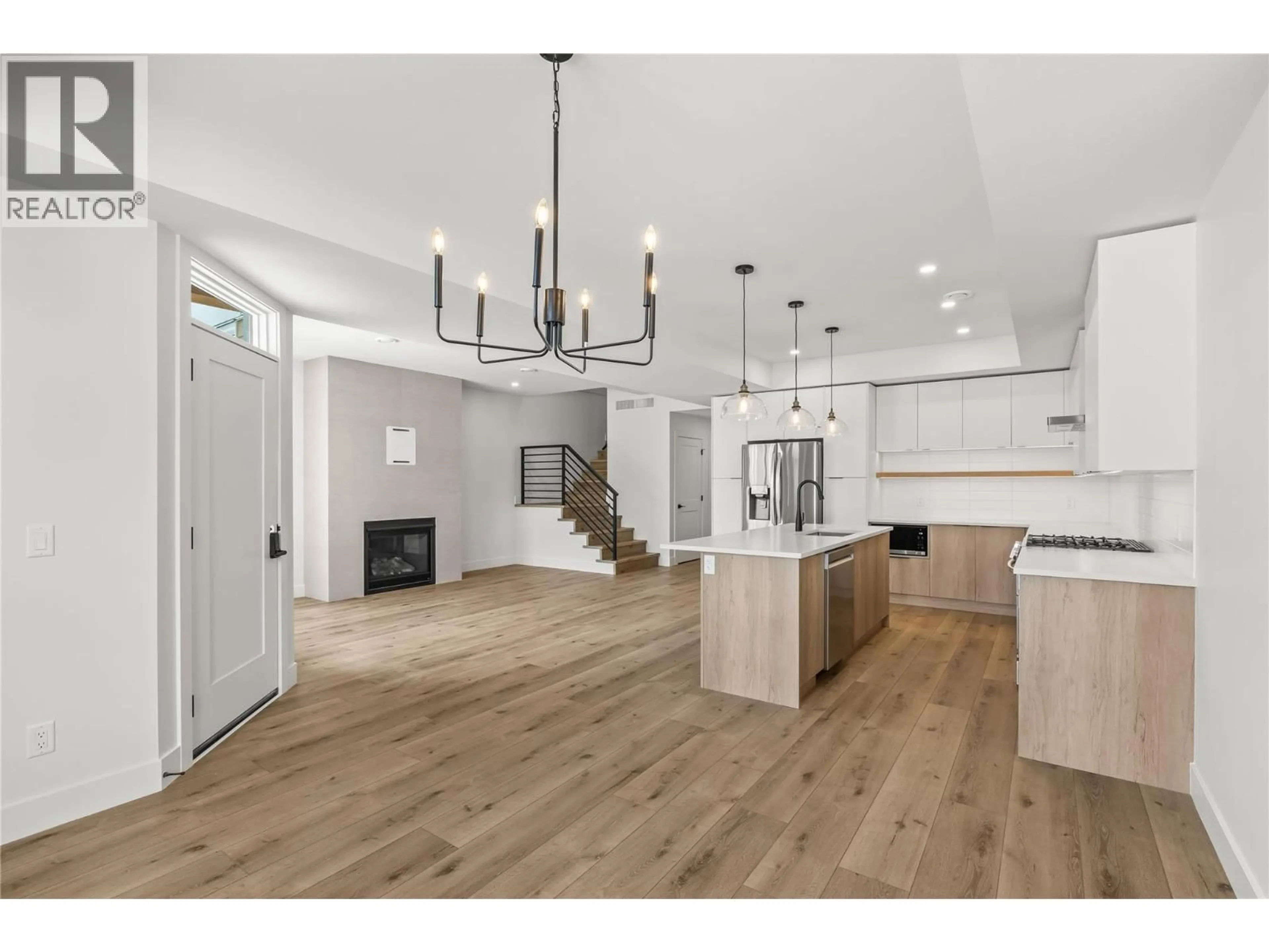 Open concept kitchen, wood/laminate floor for 751 PATTERSON AVENUE, Kelowna British Columbia V1Y5C9
