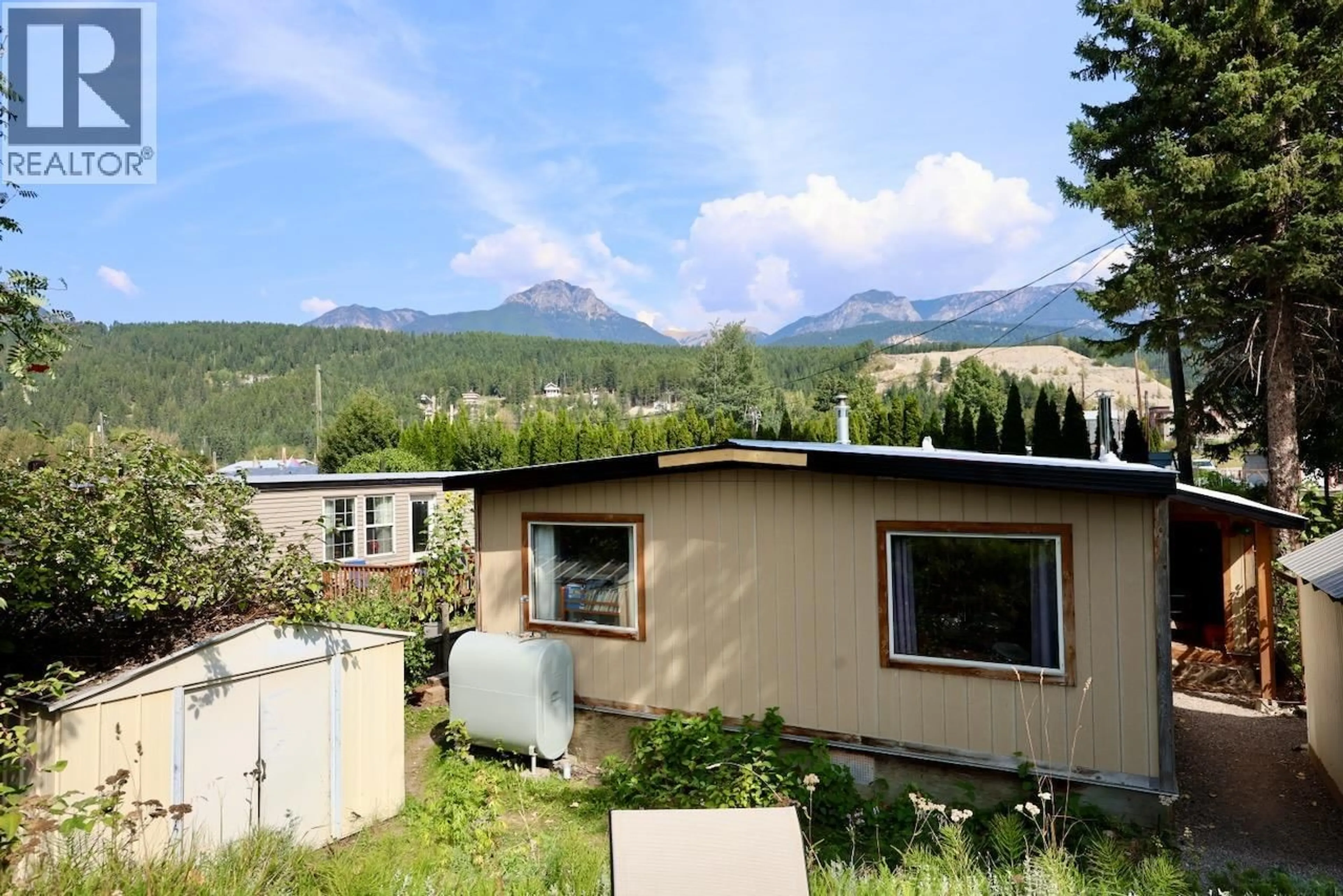 A pic from outside/outdoor area/front of a property/back of a property/a pic from drone, mountain view for 1409 11TTH AVENUE NORTH, Golden British Columbia V0A1H2