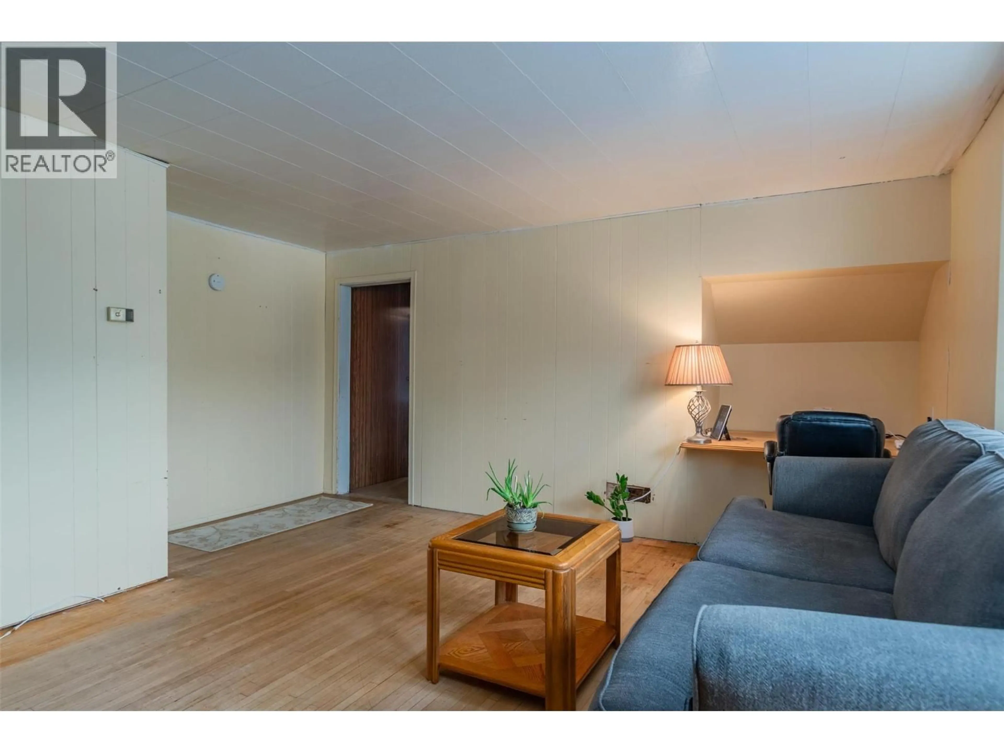 Living room with furniture, wood/laminate floor for 562 SPOKANE STREET, Trail British Columbia V1R3V8