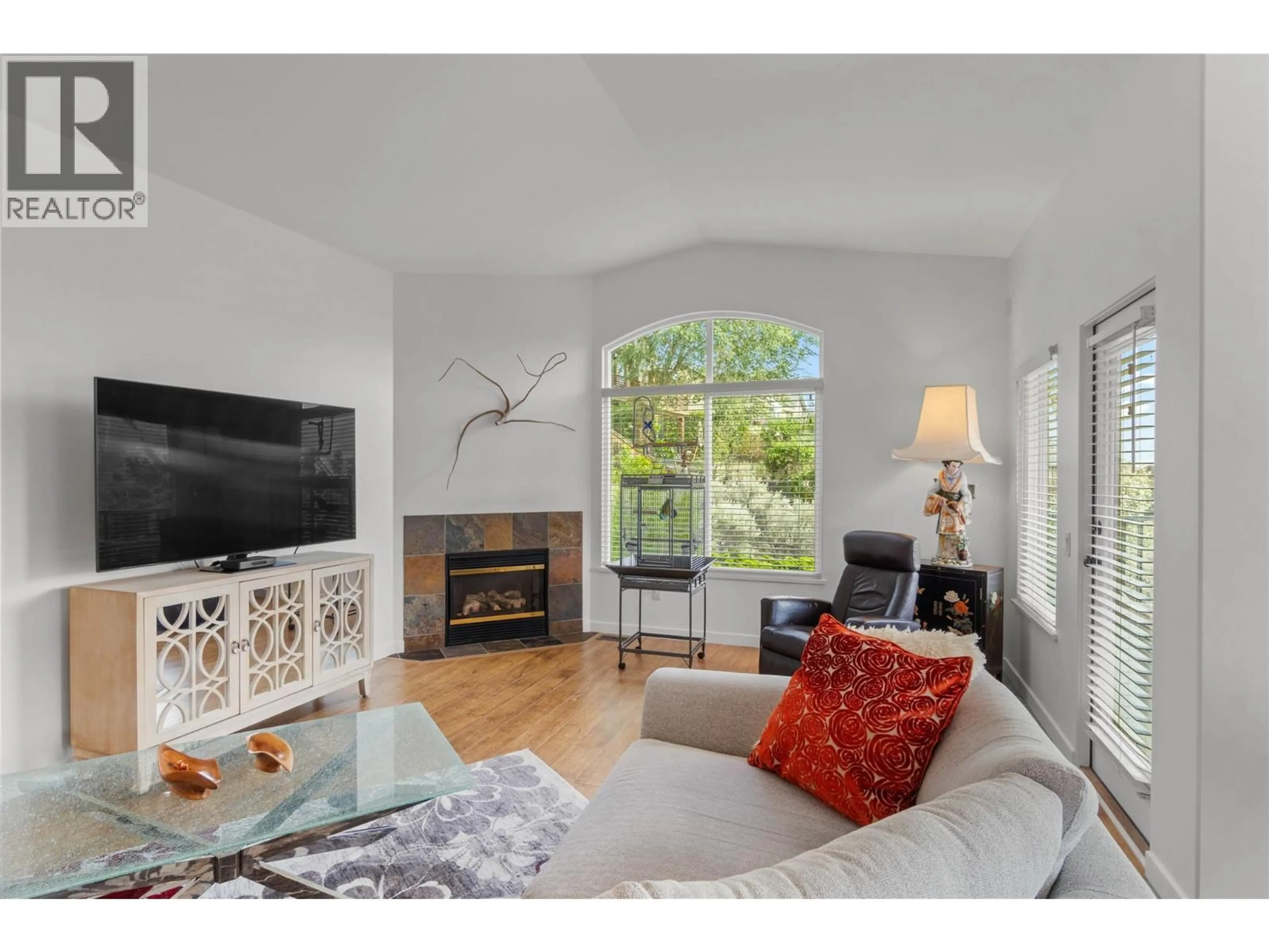 Living room with furniture, wood/laminate floor for 728 ROSEWOOD CRESCENT, Kamloops British Columbia V2H1S3