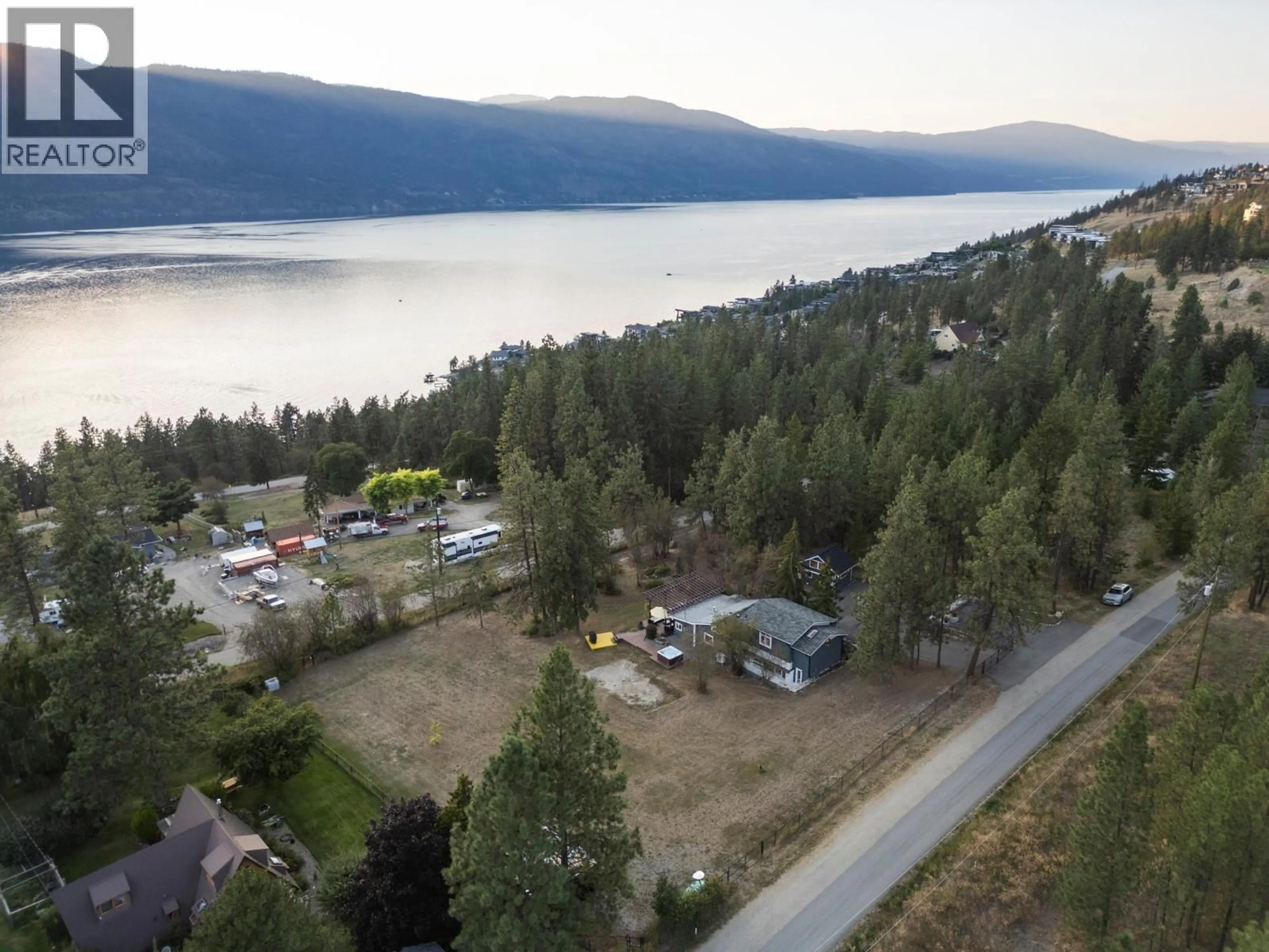 A pic from outside/outdoor area/front of a property/back of a property/a pic from drone, water/lake/river/ocean view for 5555 STUBBS ROAD, Lake Country British Columbia V4V1N1