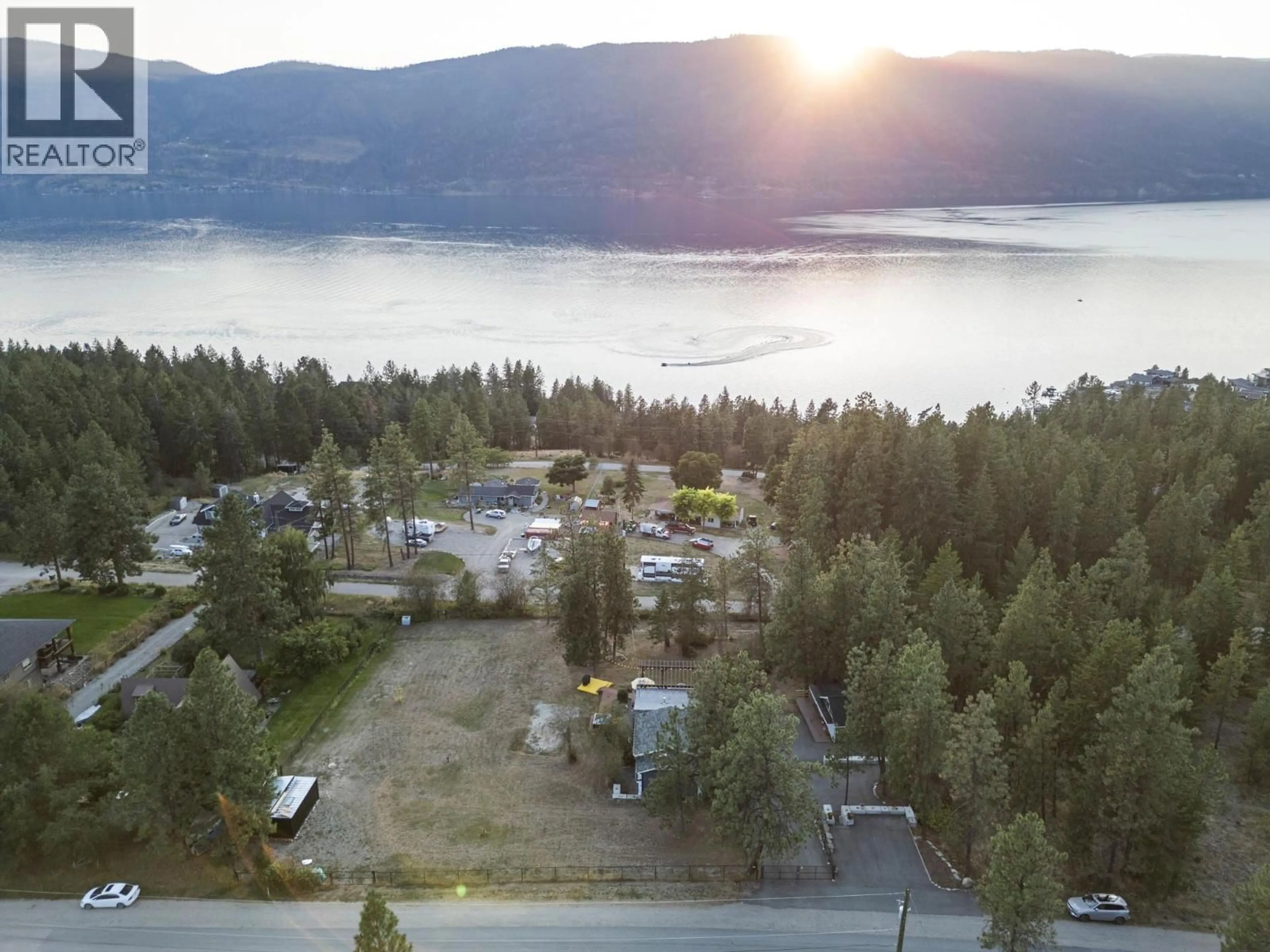 A pic from outside/outdoor area/front of a property/back of a property/a pic from drone, water/lake/river/ocean view for 5555 STUBBS ROAD, Lake Country British Columbia V4V1N1