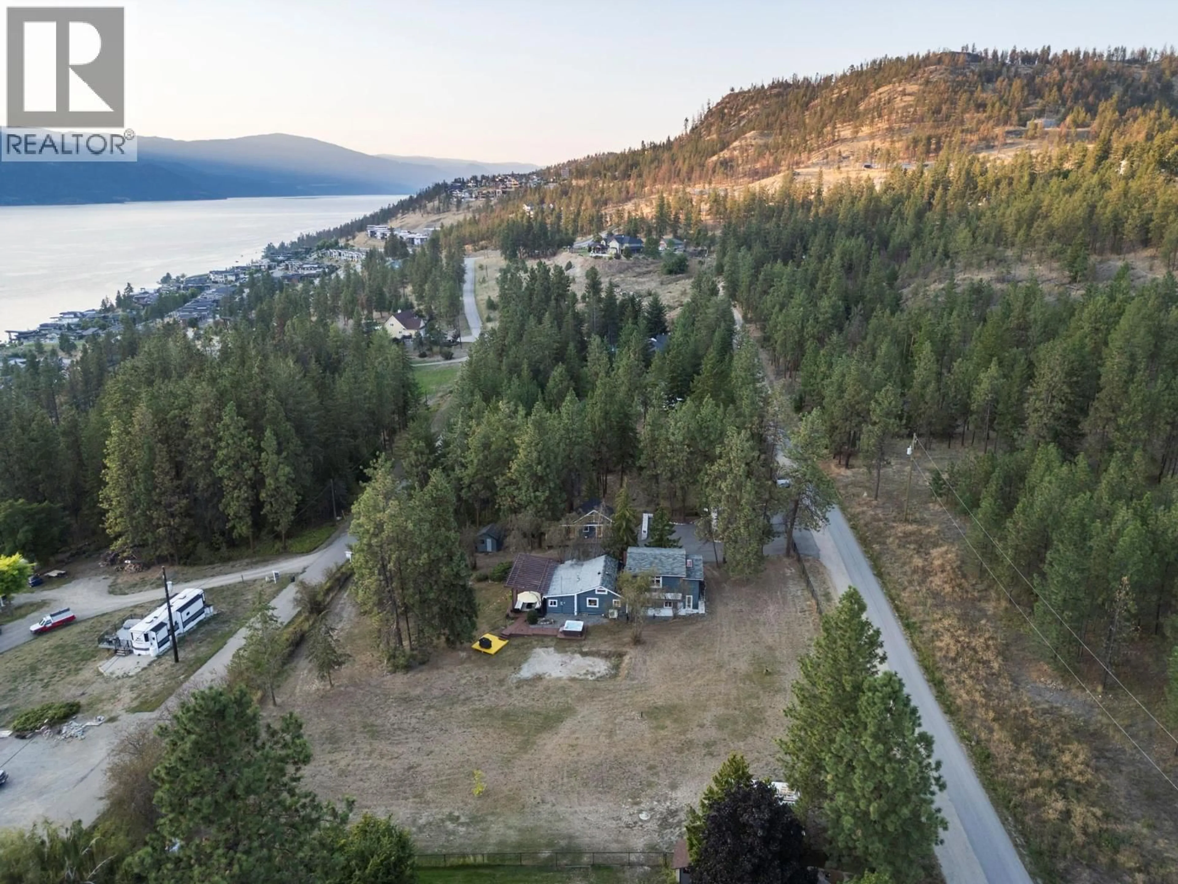 A pic from outside/outdoor area/front of a property/back of a property/a pic from drone, water/lake/river/ocean view for 5555 STUBBS ROAD, Lake Country British Columbia V4V1N1