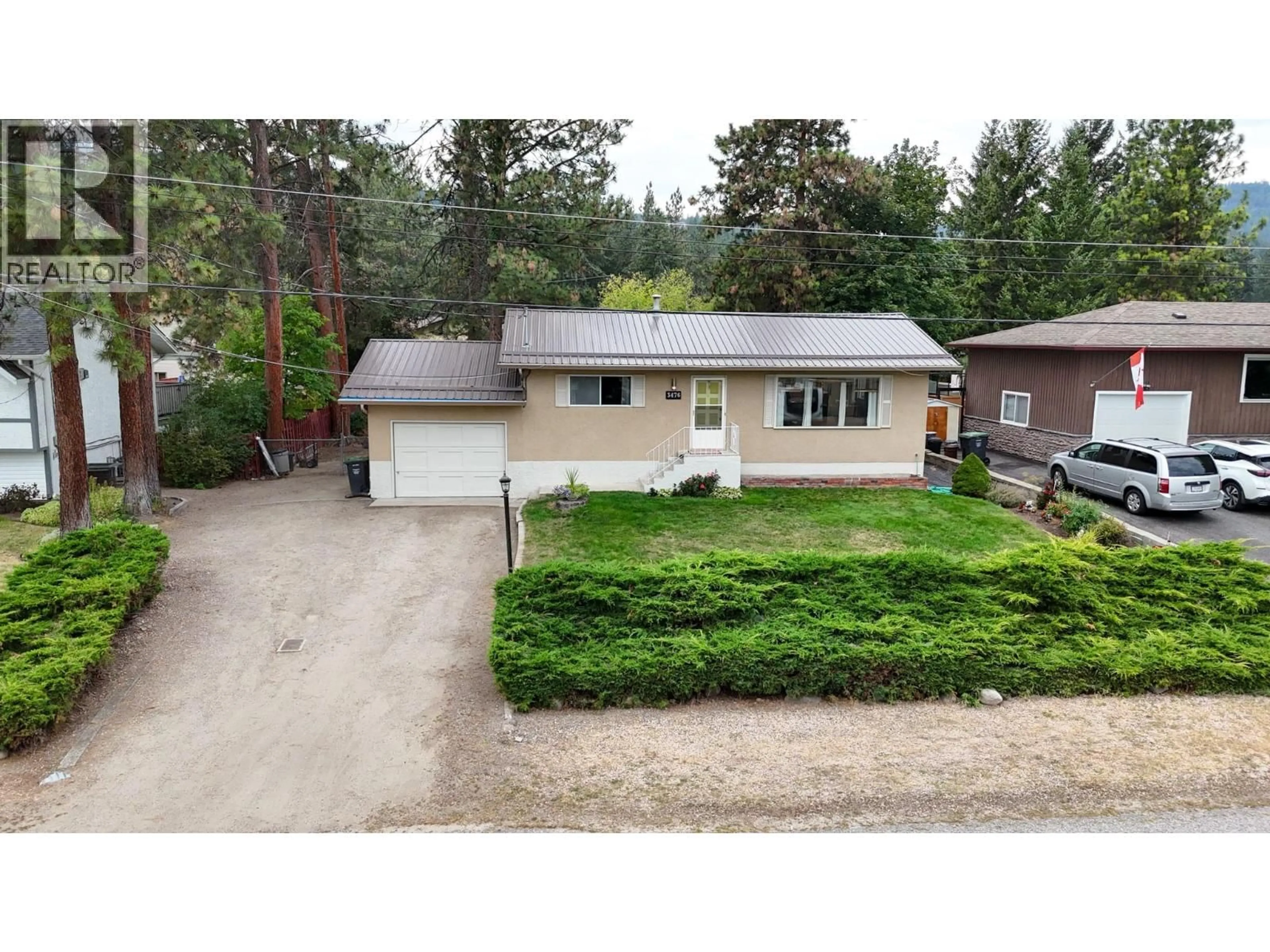 A pic from outside/outdoor area/front of a property/back of a property/a pic from drone, street for 3476 MALCOLM ROAD, West Kelowna British Columbia V4T1H4