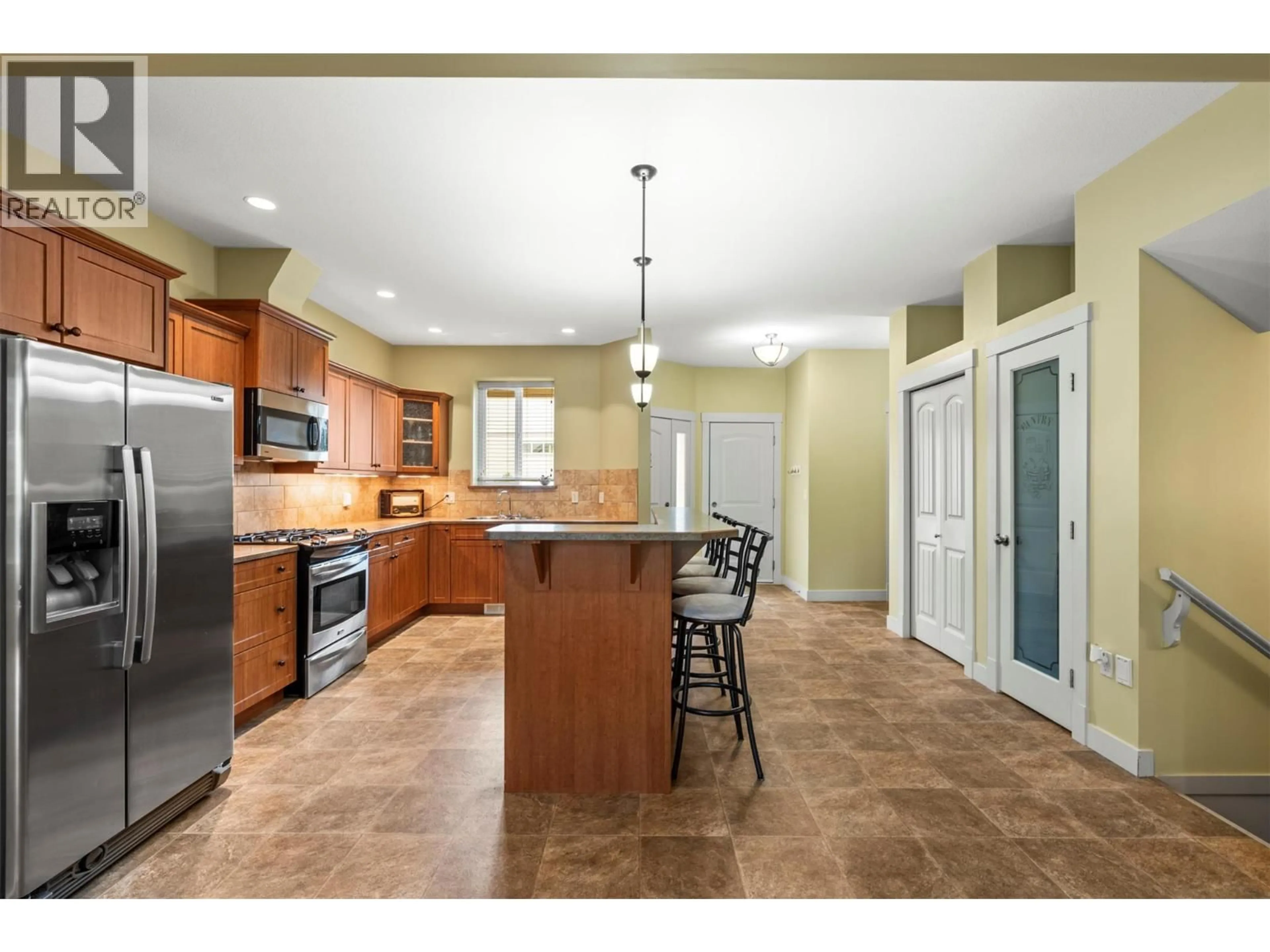 Open concept kitchen, ceramic/tile floor for 217 - 3780 SCHUBERT ROAD, Armstrong British Columbia V0E1B4