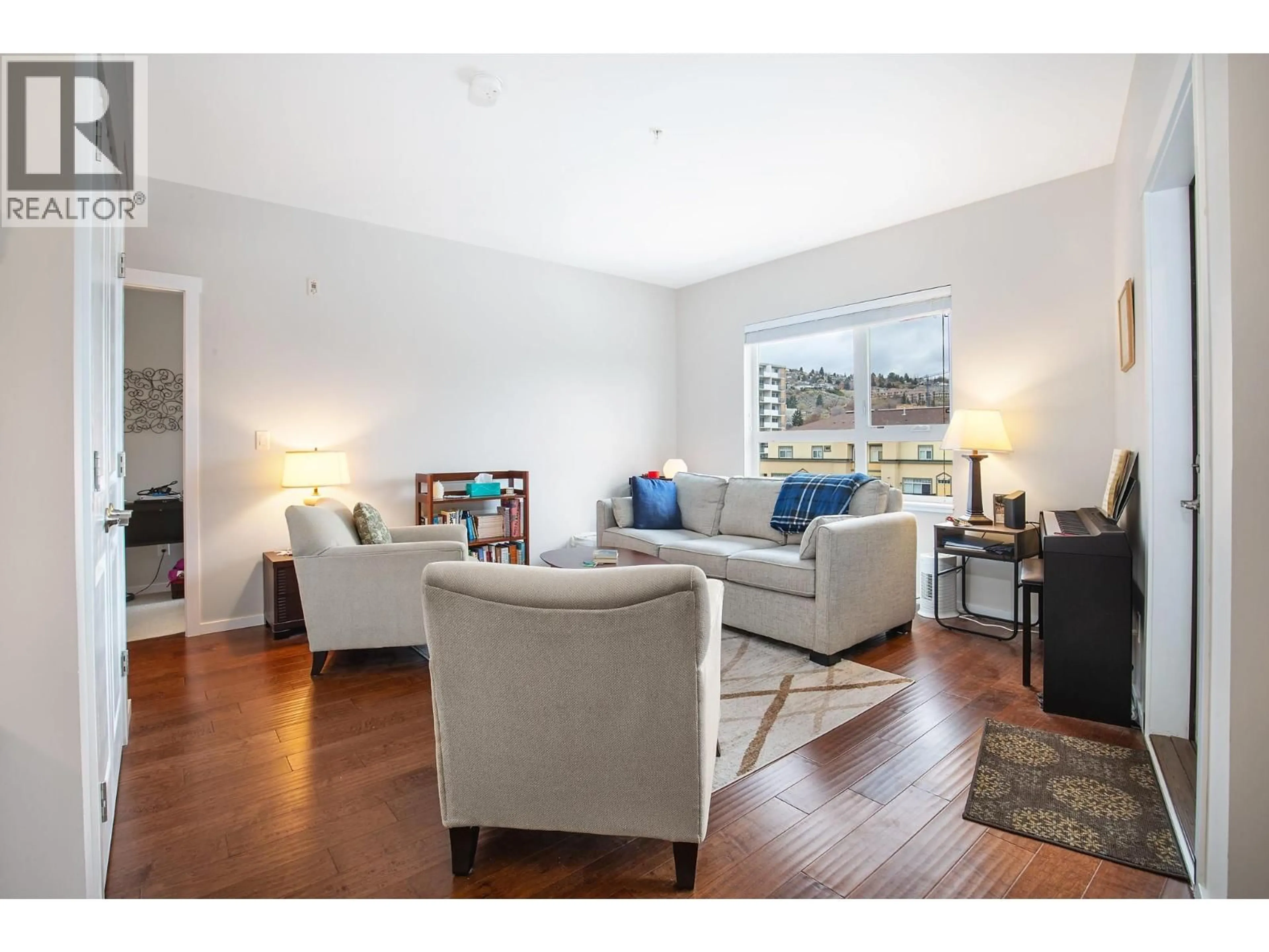 Living room with furniture, wood/laminate floor for 508 - 429 ST. PAUL STREET, Kamloops British Columbia V2C2J7