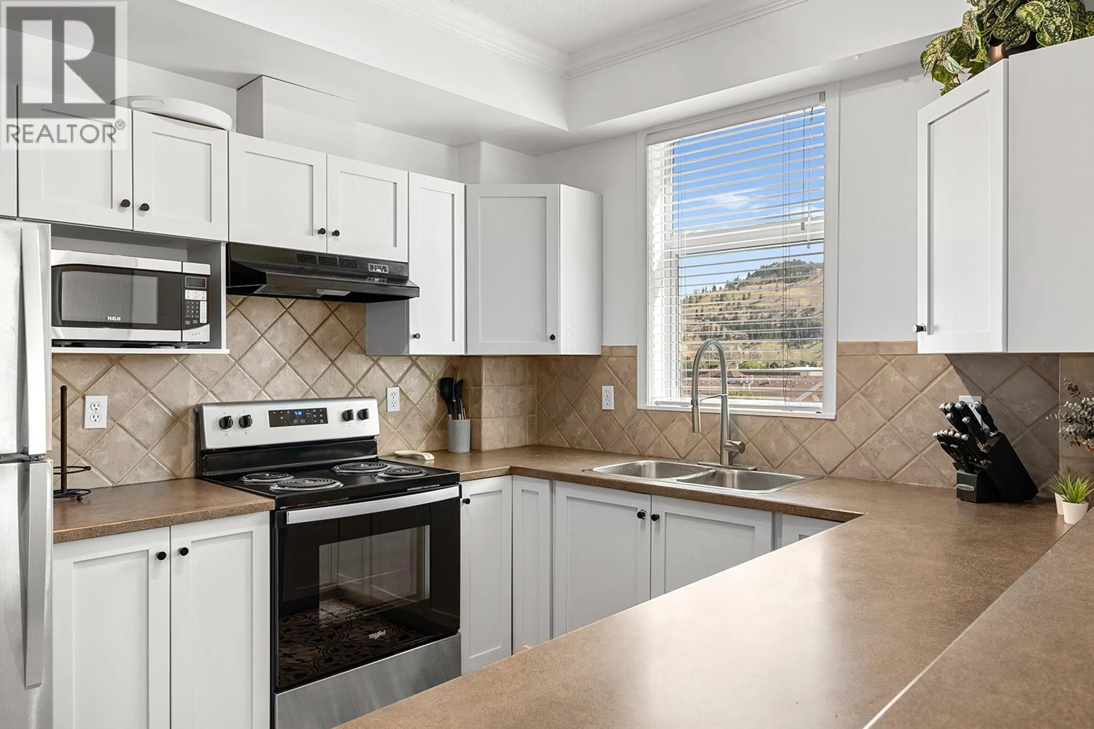 Standard kitchen, ceramic/tile floor for 703 - 1128 SUNSET DRIVE, Kelowna British Columbia V1Y9W7