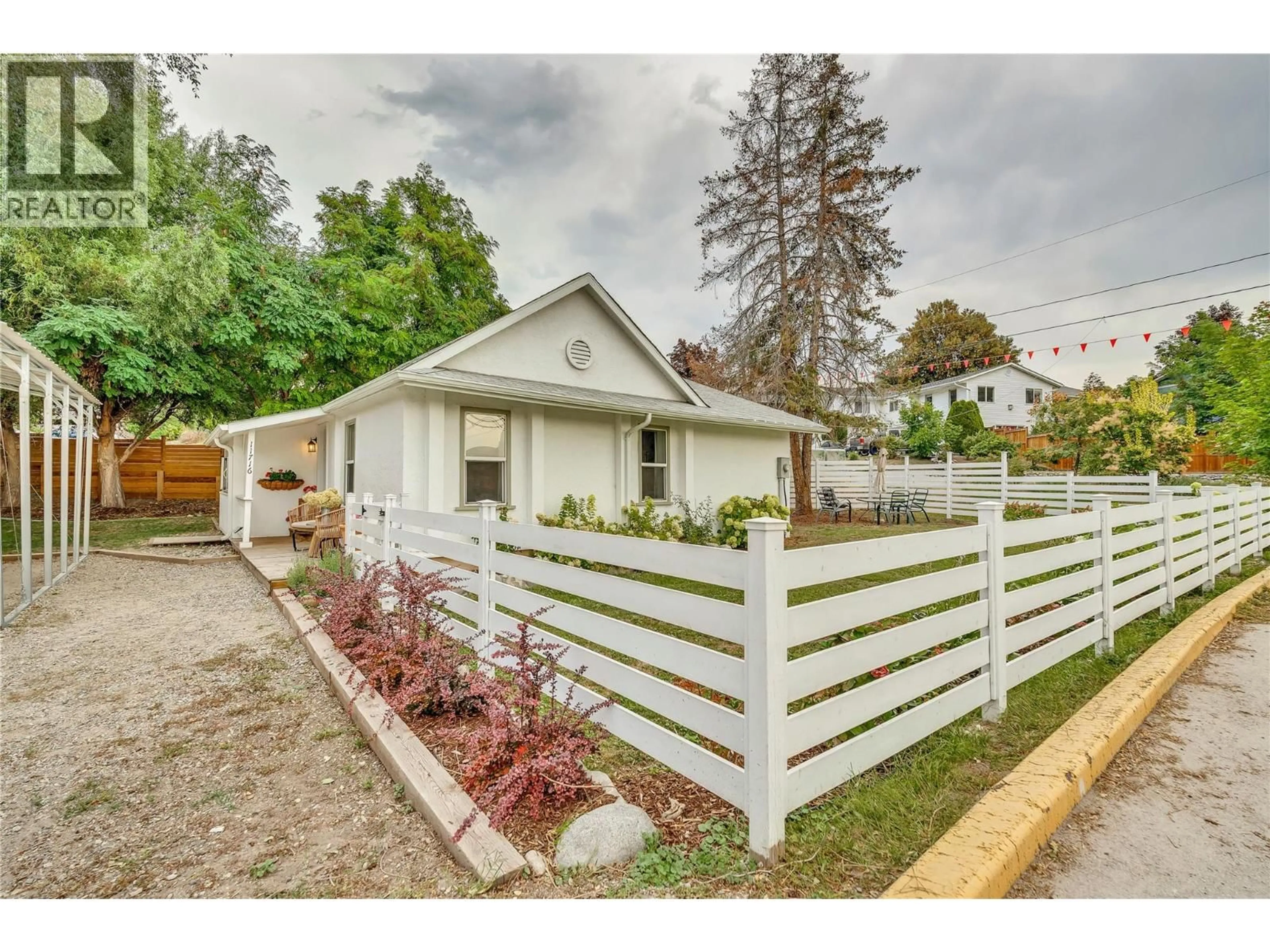Home with vinyl exterior material, street for 11716 PRAIRIE VALLEY ROAD, Summerland British Columbia V0H1Z8