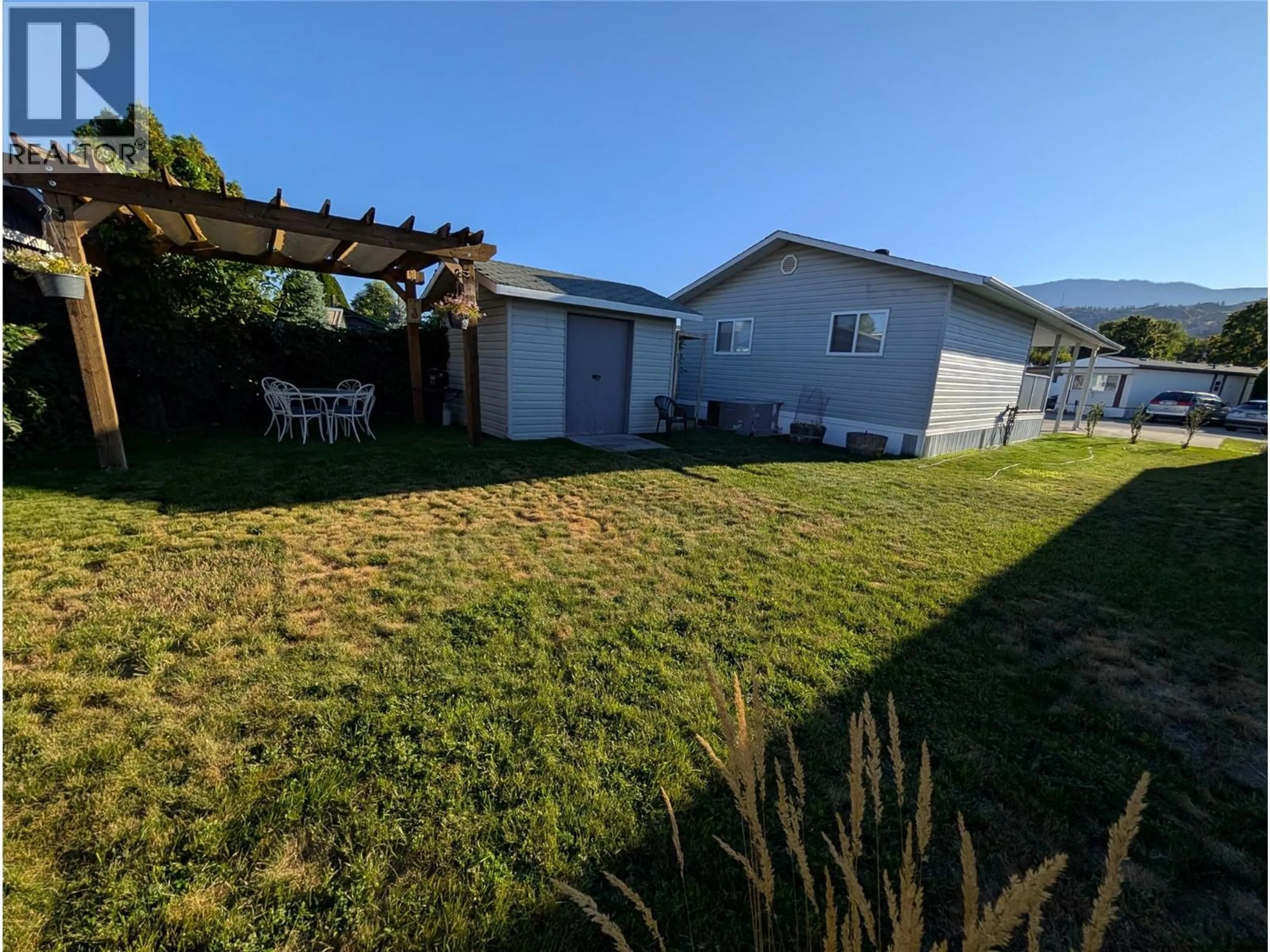 A pic from outside/outdoor area/front of a property/back of a property/a pic from drone, street for 5 - 6778 TUCELNUIT DRIVE, Oliver British Columbia V0H1T3