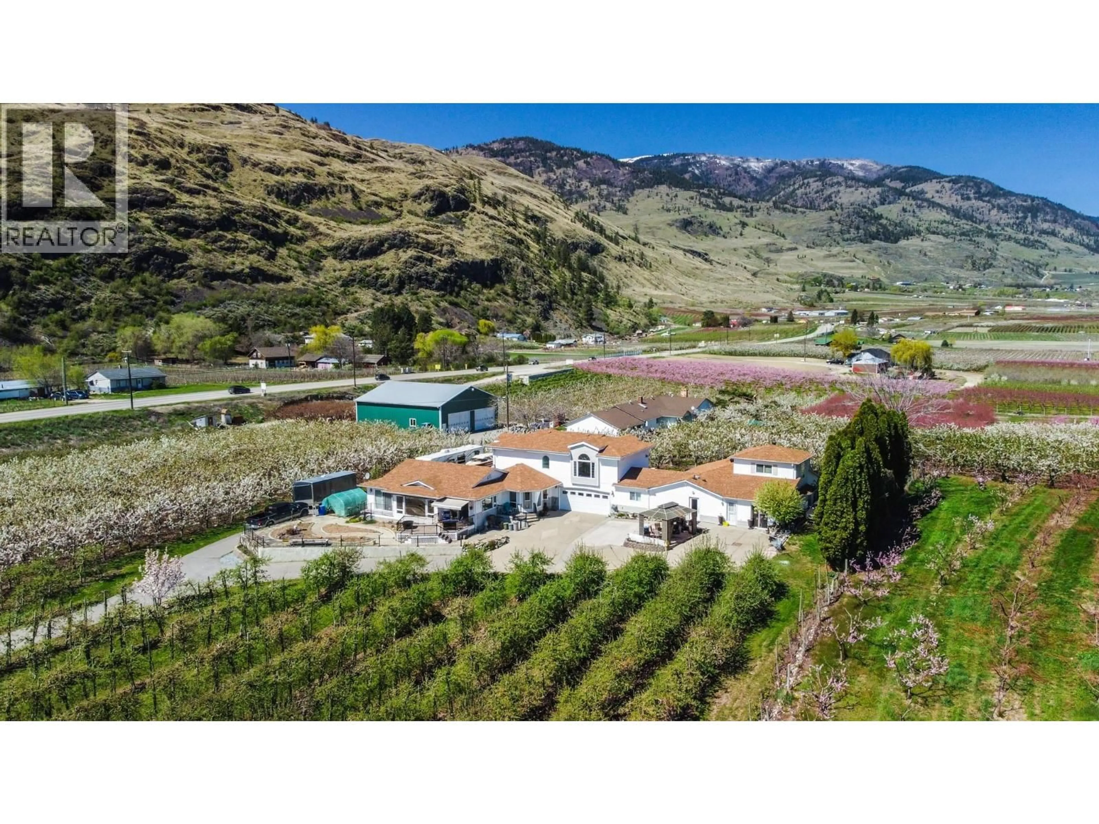 A pic from outside/outdoor area/front of a property/back of a property/a pic from drone, mountain view for 384 19 ROAD, Oliver British Columbia V0H1T1