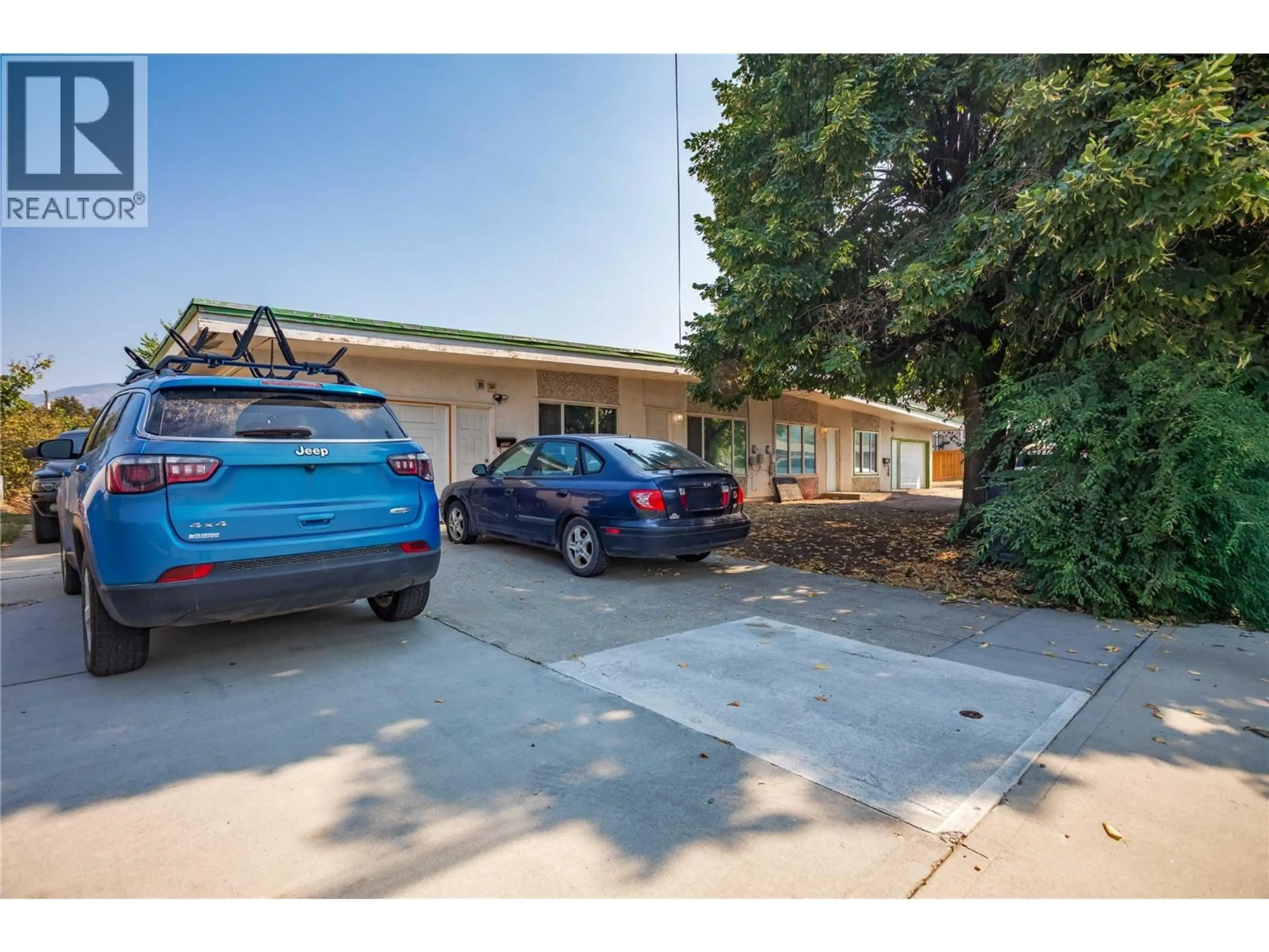 A pic from outside/outdoor area/front of a property/back of a property/a pic from drone, street for 715A GERSTMAR ROAD, Kelowna British Columbia V1X4B4