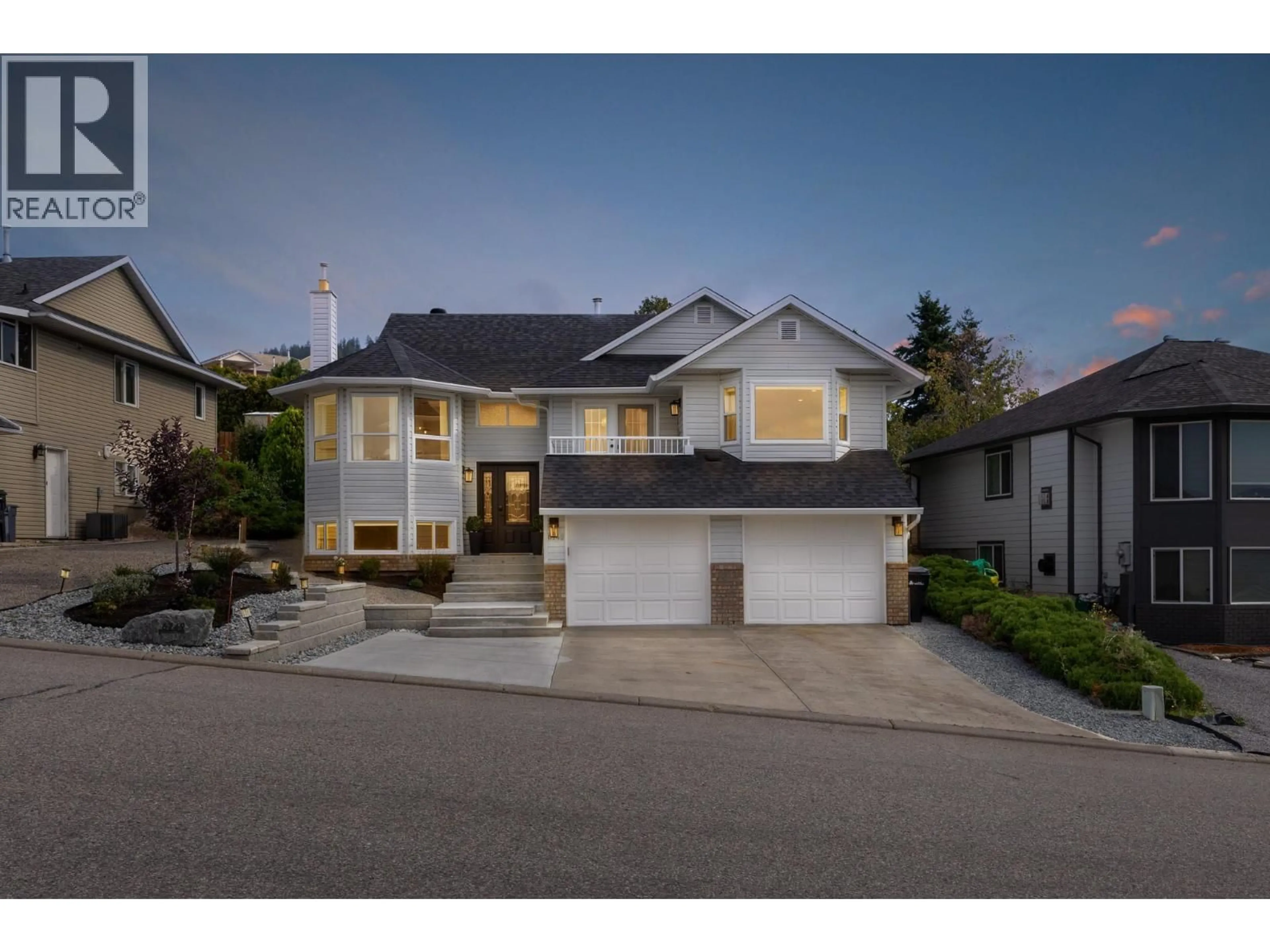Home with vinyl exterior material, street for 6749 FOOTHILLS DRIVE, Vernon British Columbia V1B2Y3