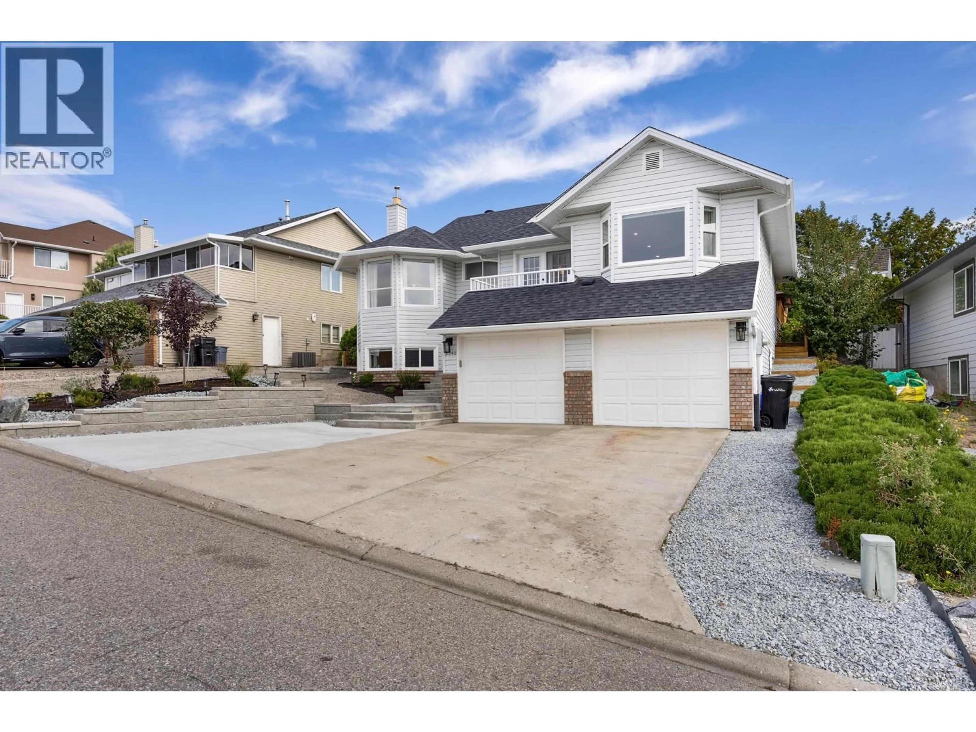 Home with vinyl exterior material, street for 6749 FOOTHILLS DRIVE, Vernon British Columbia V1B2Y3