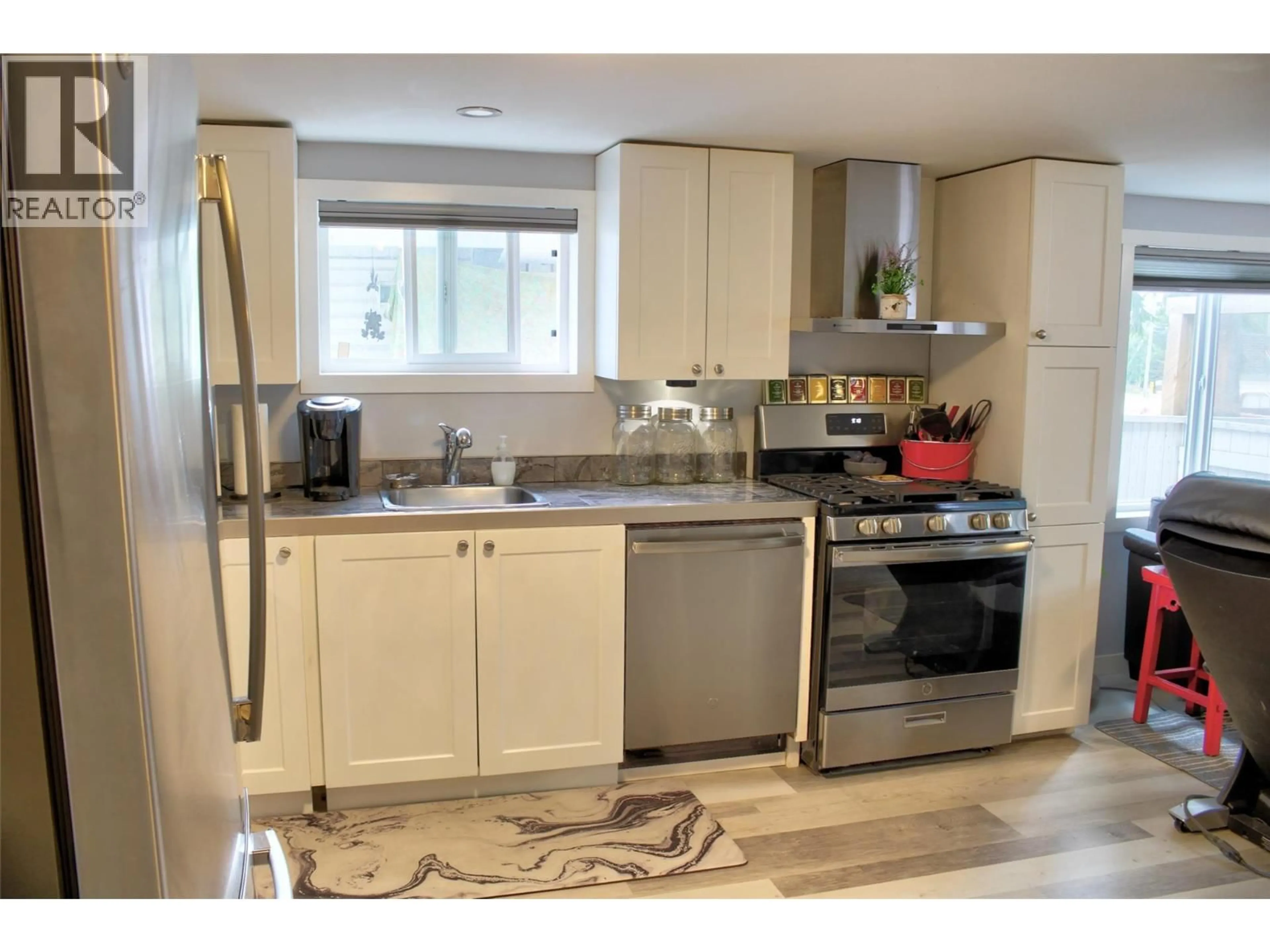 Open concept kitchen, wood/laminate floor for 4 - 6588 97A HIGHWAY, Enderby British Columbia V0E1V3
