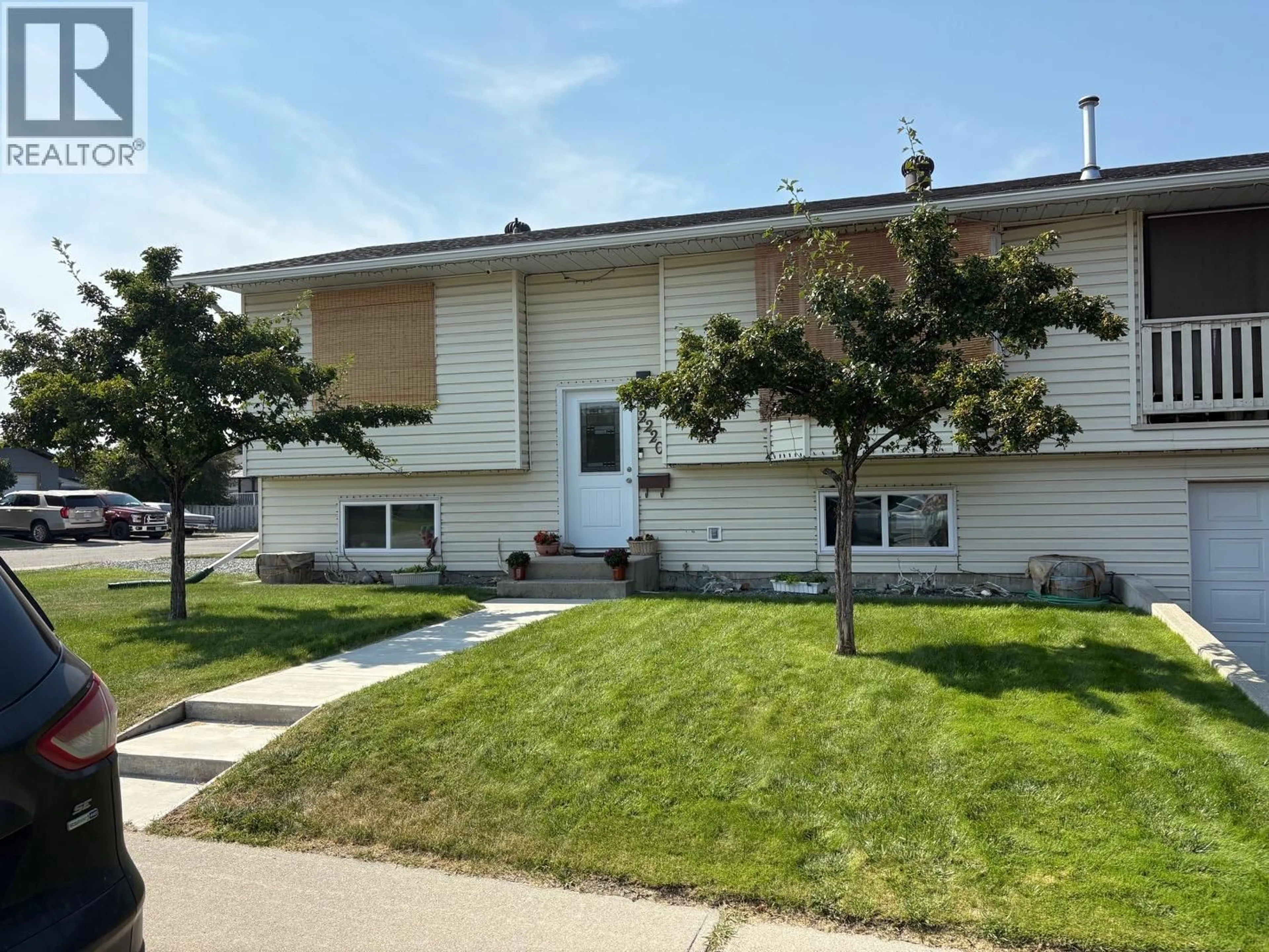 Home with vinyl exterior material, street for 2220 3A STREET SOUTH, Cranbrook British Columbia V1C5K6