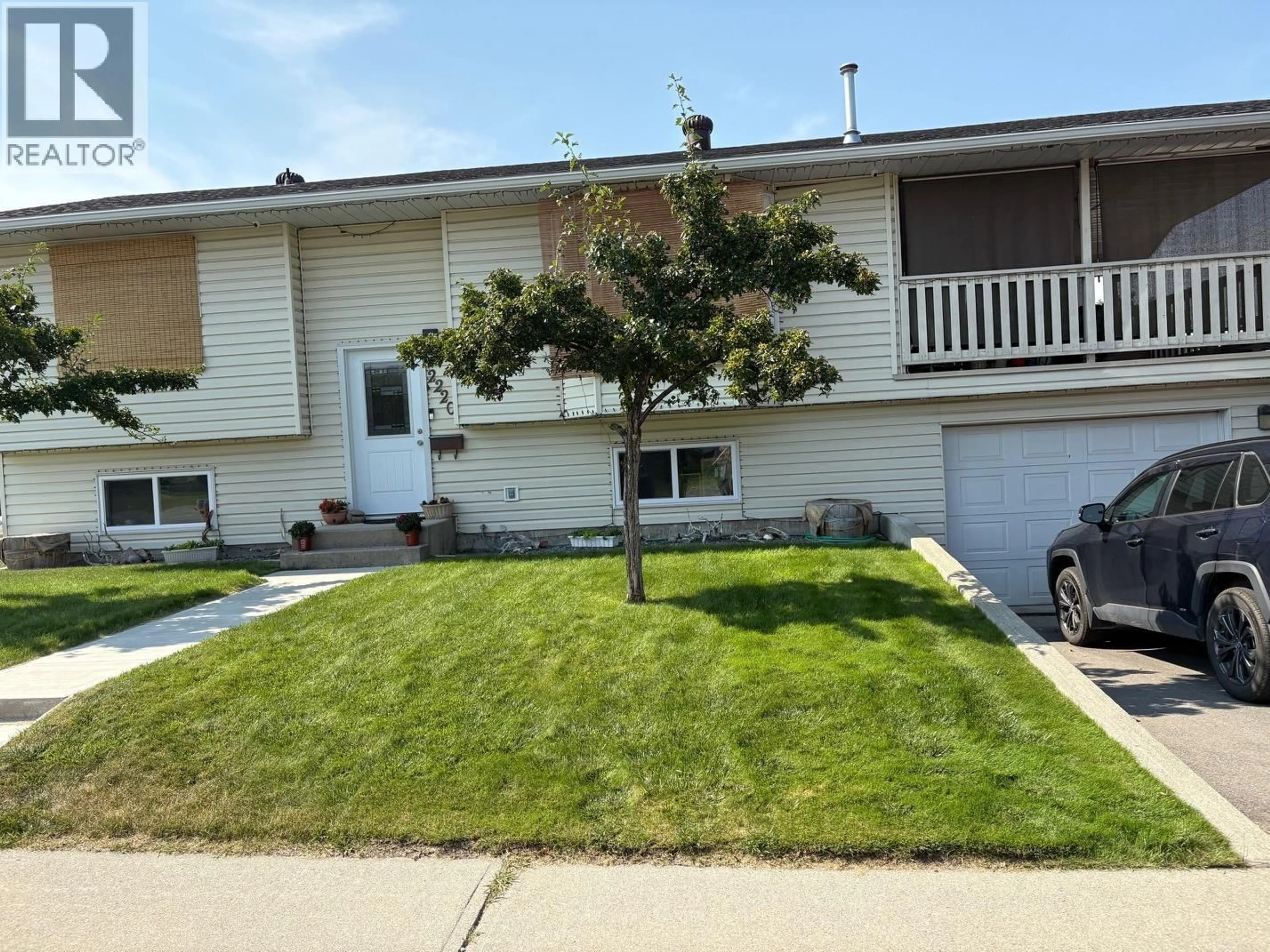 Home with vinyl exterior material, street for 2220 3A STREET SOUTH, Cranbrook British Columbia V1C5K6