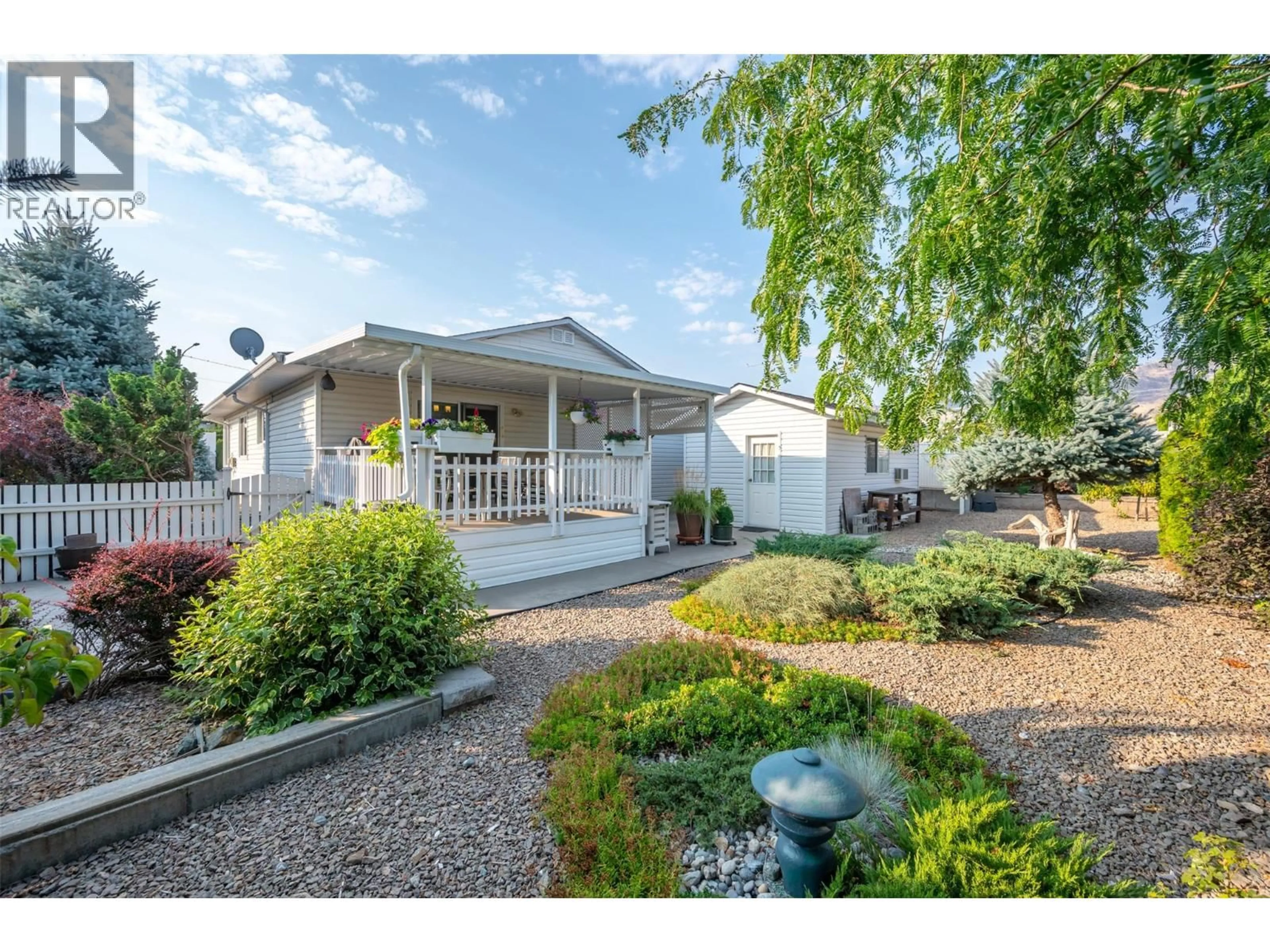 Home with vinyl exterior material, street for 8518 PRIMROSE LANE, Osoyoos British Columbia V0H1V1
