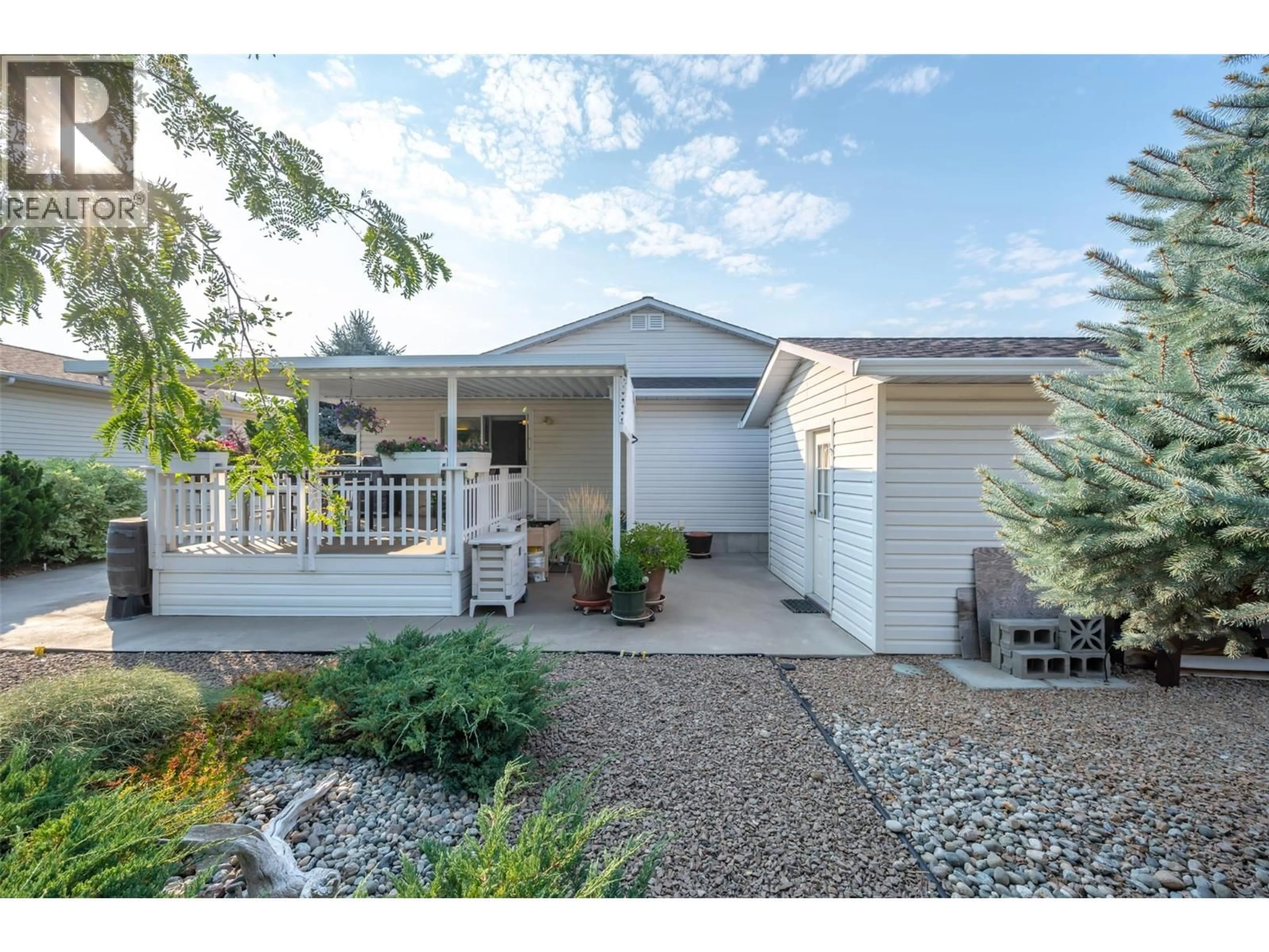 Home with vinyl exterior material, street for 8518 PRIMROSE LANE, Osoyoos British Columbia V0H1V1