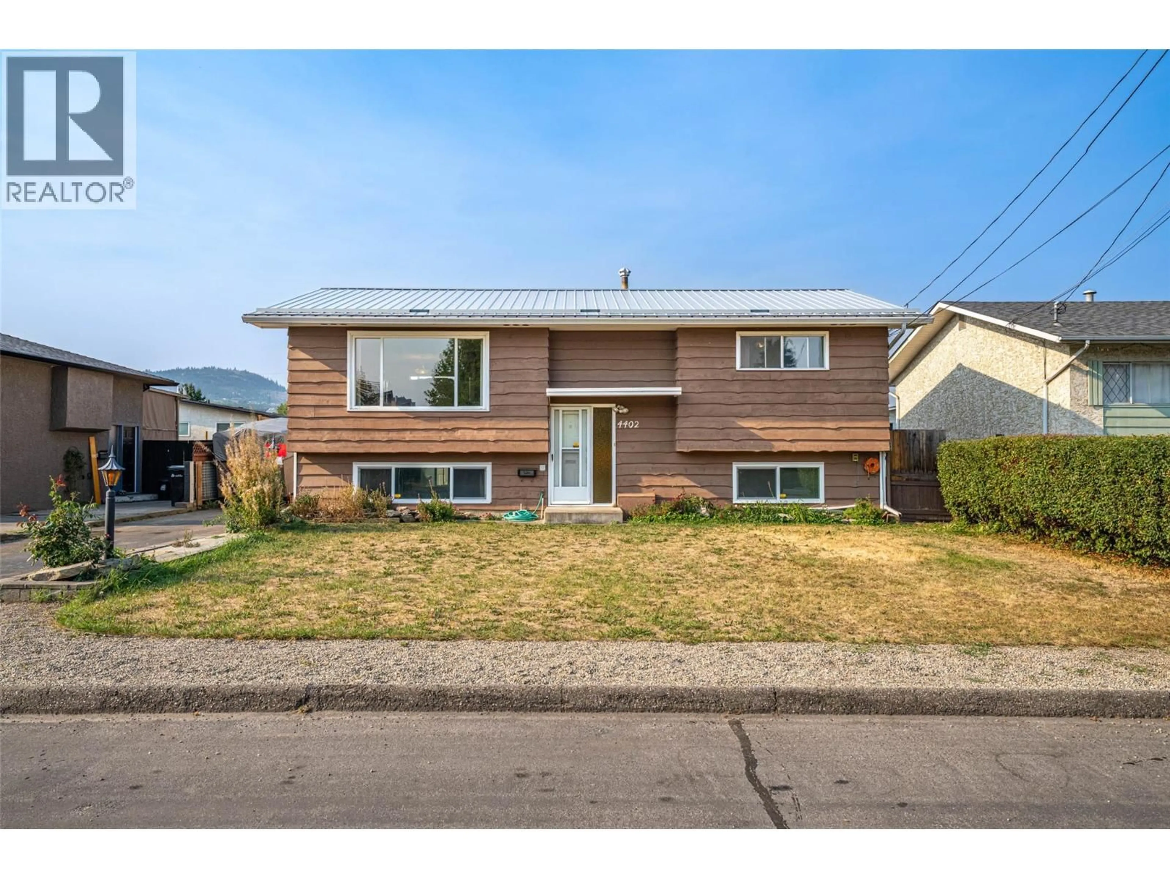Home with vinyl exterior material, street for 4402 16 AVENUE, Vernon British Columbia V1T6P4