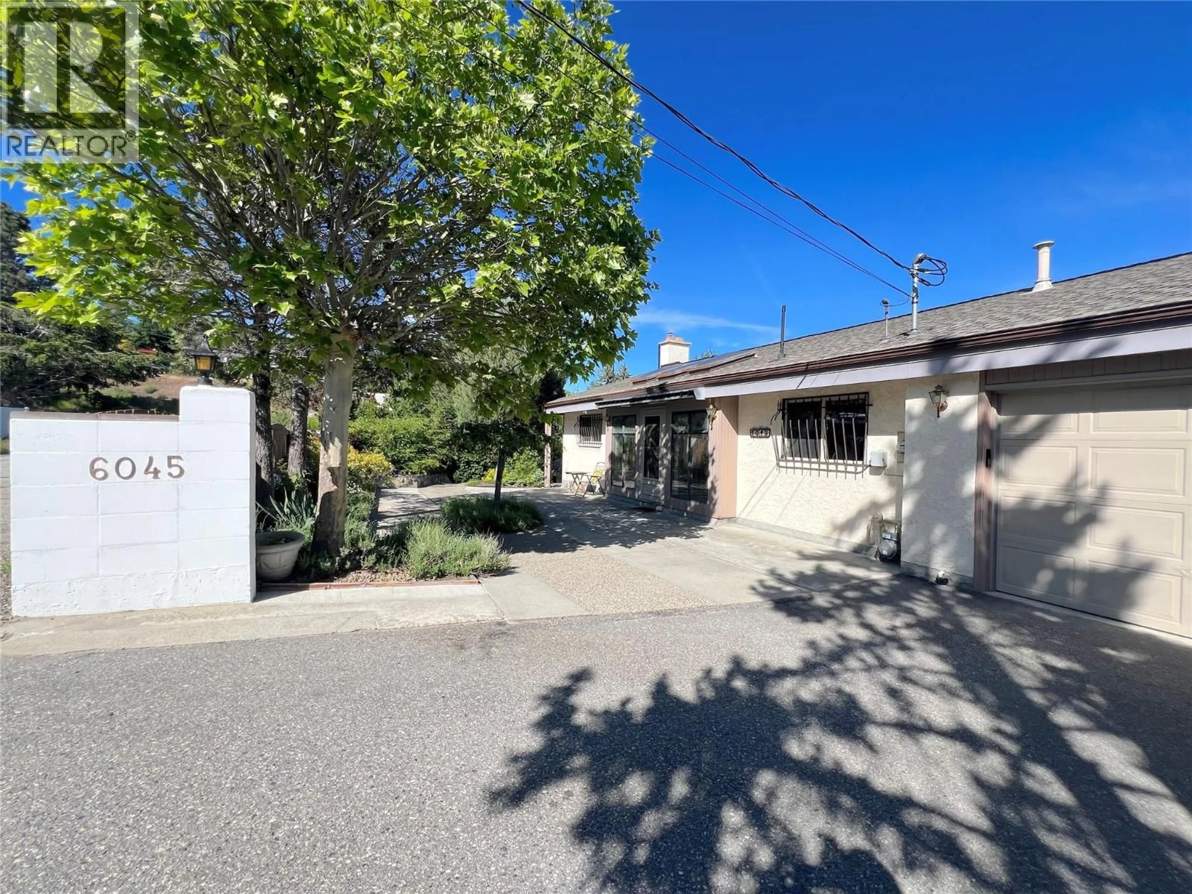 A pic from outside/outdoor area/front of a property/back of a property/a pic from drone, street for 6045 ELLISON AVENUE, Peachland British Columbia V0H1X4