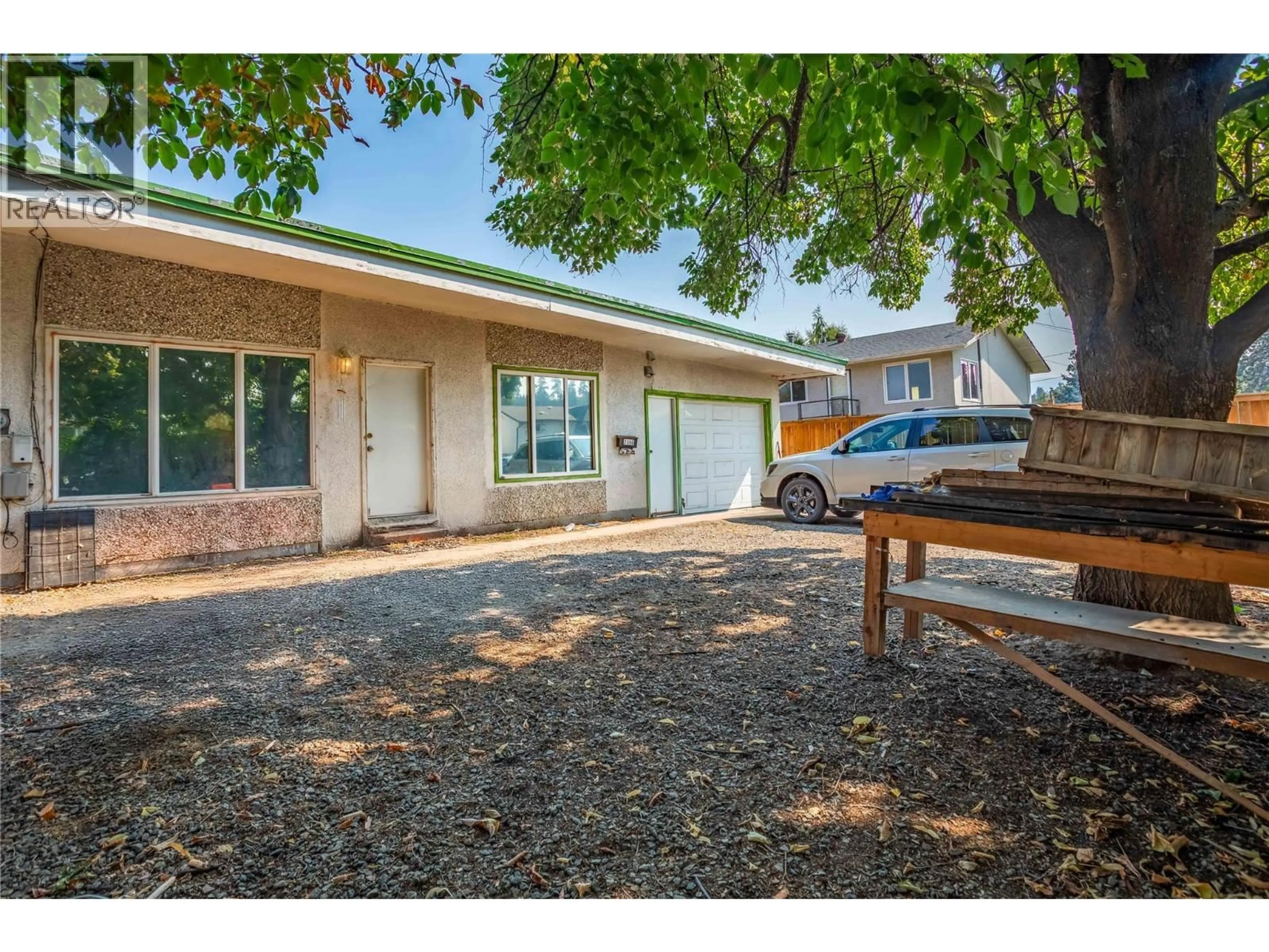A pic from outside/outdoor area/front of a property/back of a property/a pic from drone, street for 715B GERSTMAR ROAD, Kelowna British Columbia V1X4B4
