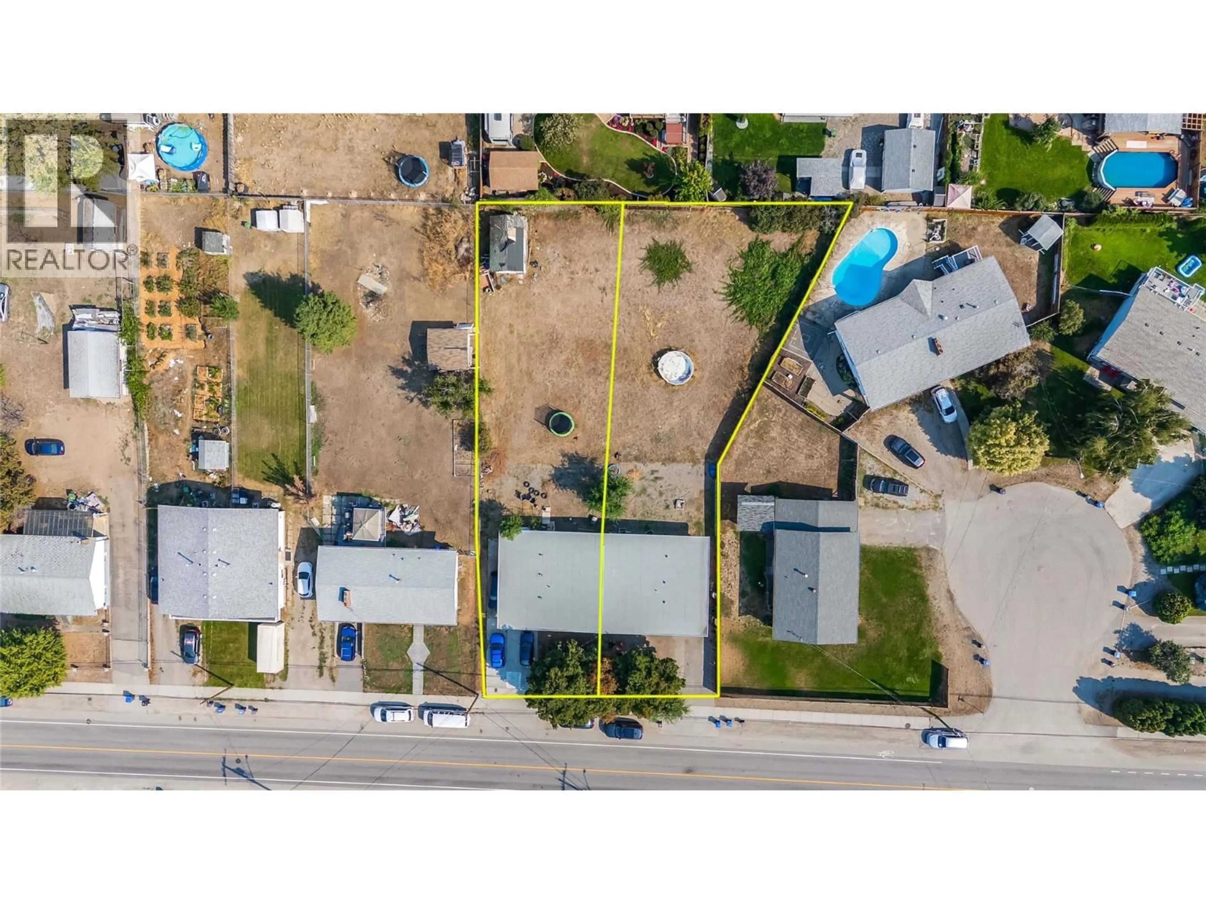A pic from outside/outdoor area/front of a property/back of a property/a pic from drone, street for 715B GERSTMAR ROAD, Kelowna British Columbia V1X4B4