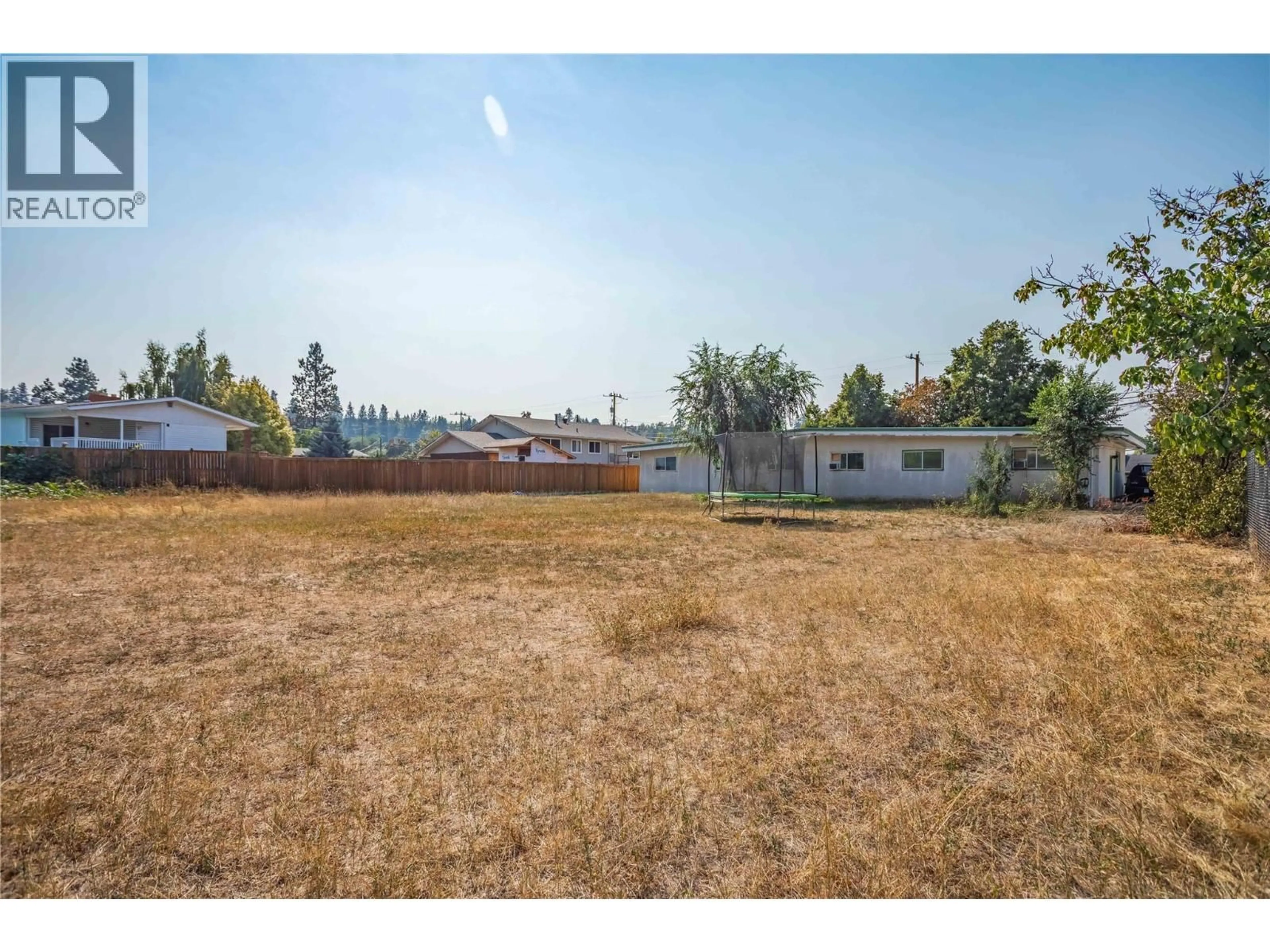 A pic from outside/outdoor area/front of a property/back of a property/a pic from drone, unknown for 715B GERSTMAR ROAD, Kelowna British Columbia V1X4B4