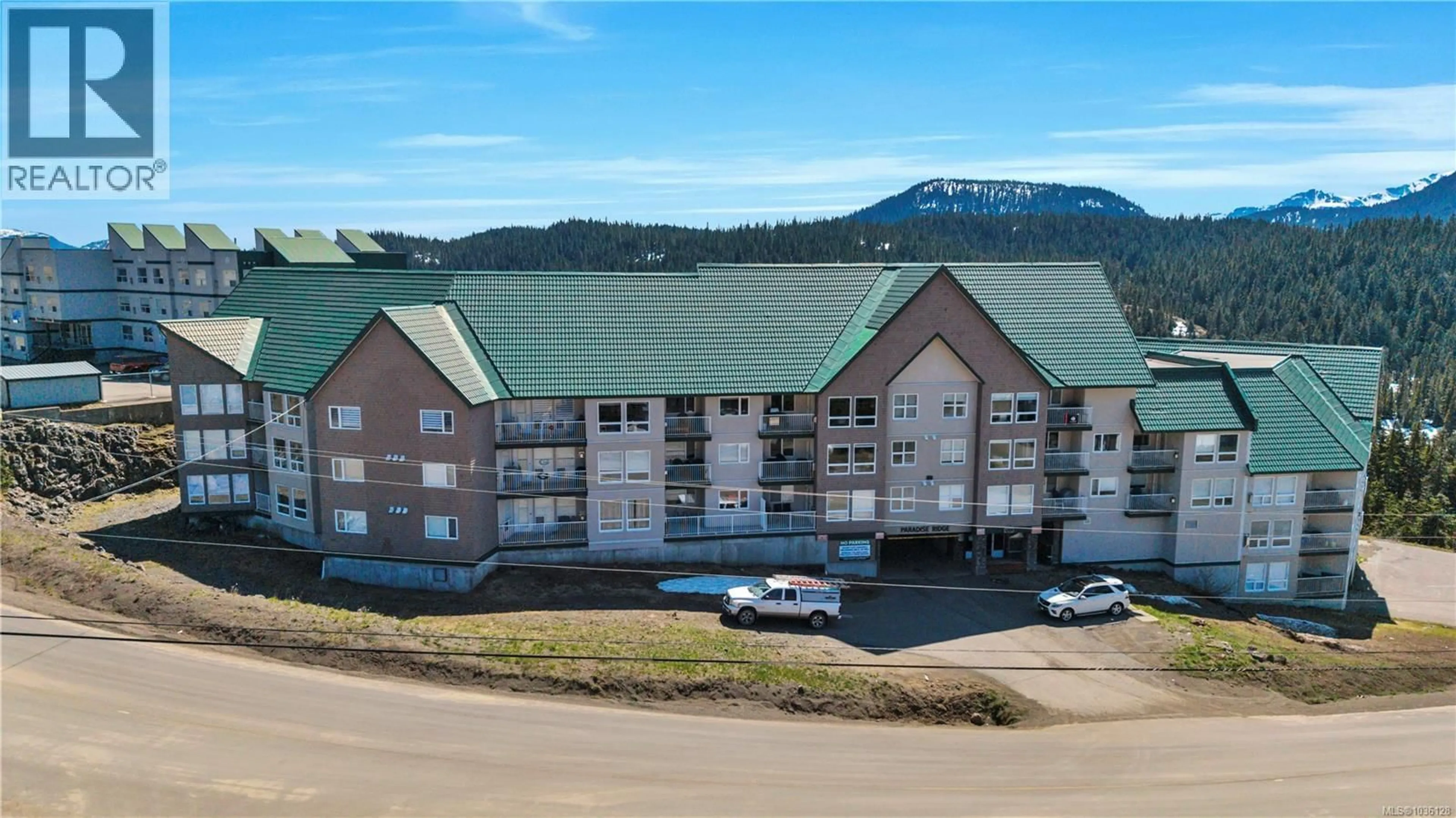 A pic from outside/outdoor area/front of a property/back of a property/a pic from drone, mountain view for 407 - 1201 HENRY ROAD, Courtenay British Columbia V9J1L0