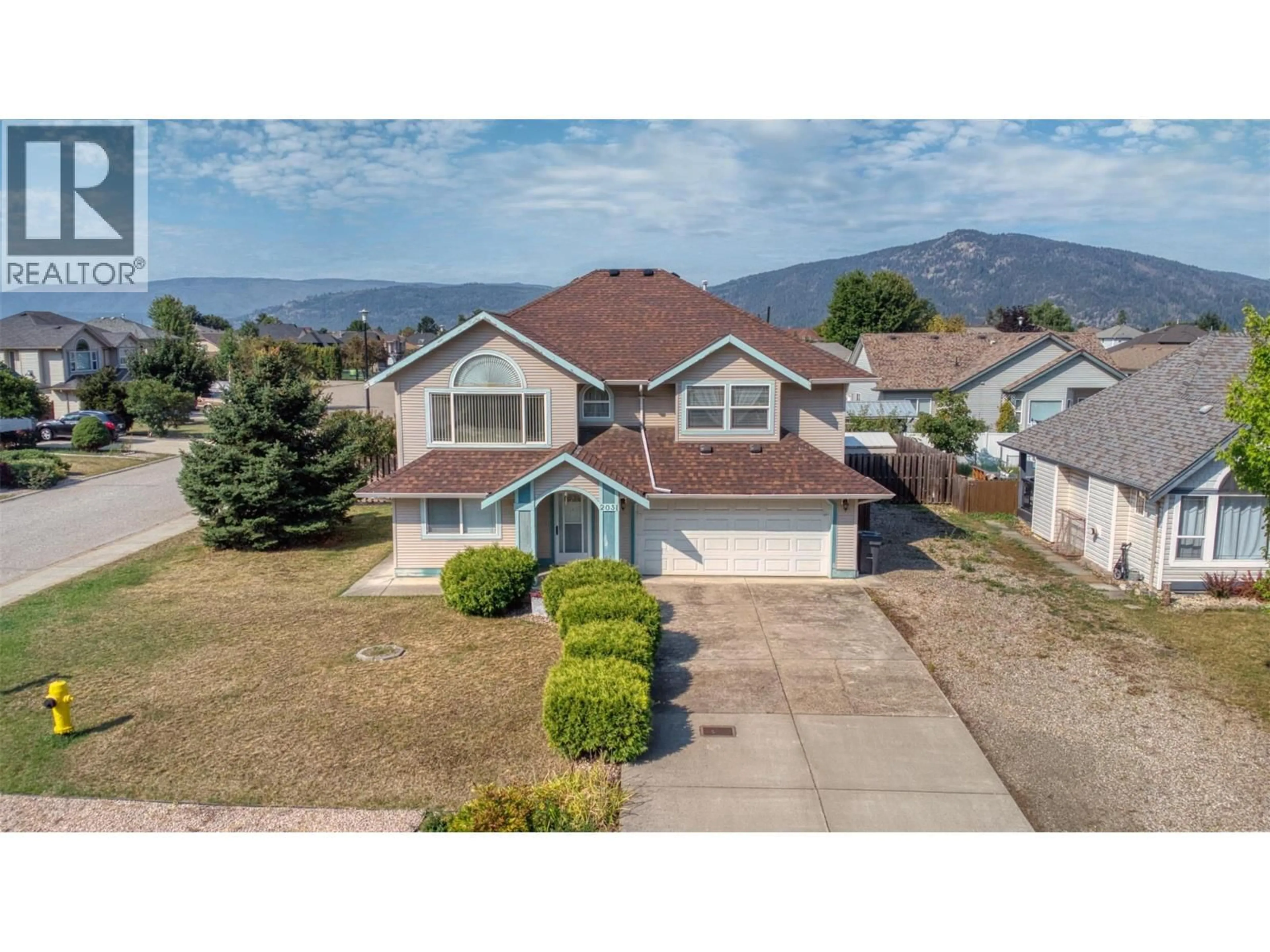 A pic from outside/outdoor area/front of a property/back of a property/a pic from drone, mountain view for 2031 GAME COURT, Armstrong British Columbia V0E1B1