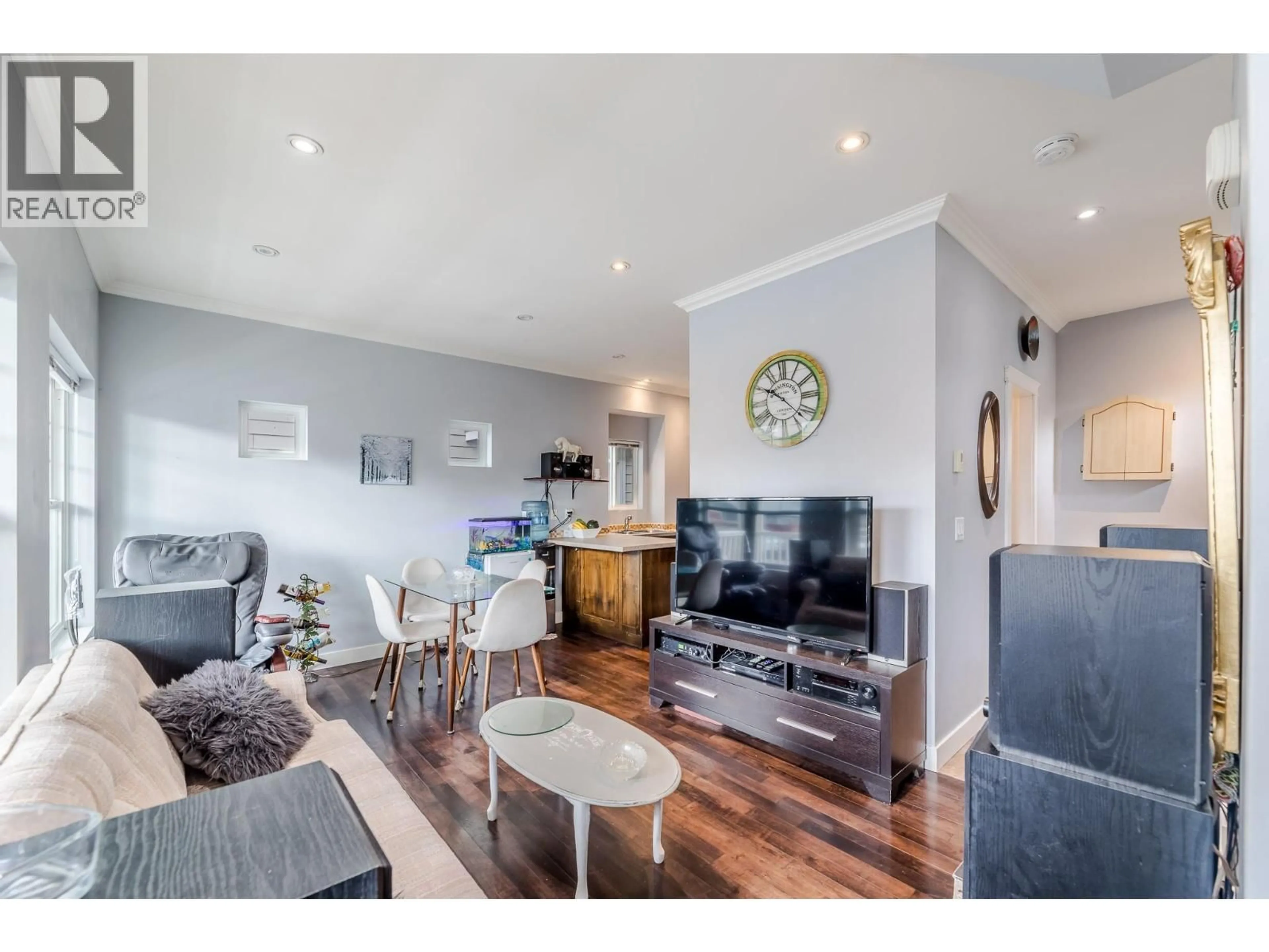 Living room with furniture, wood/laminate floor for 102 - 454 WESTMINSTER AVENUE WEST, Penticton British Columbia V2A1K5