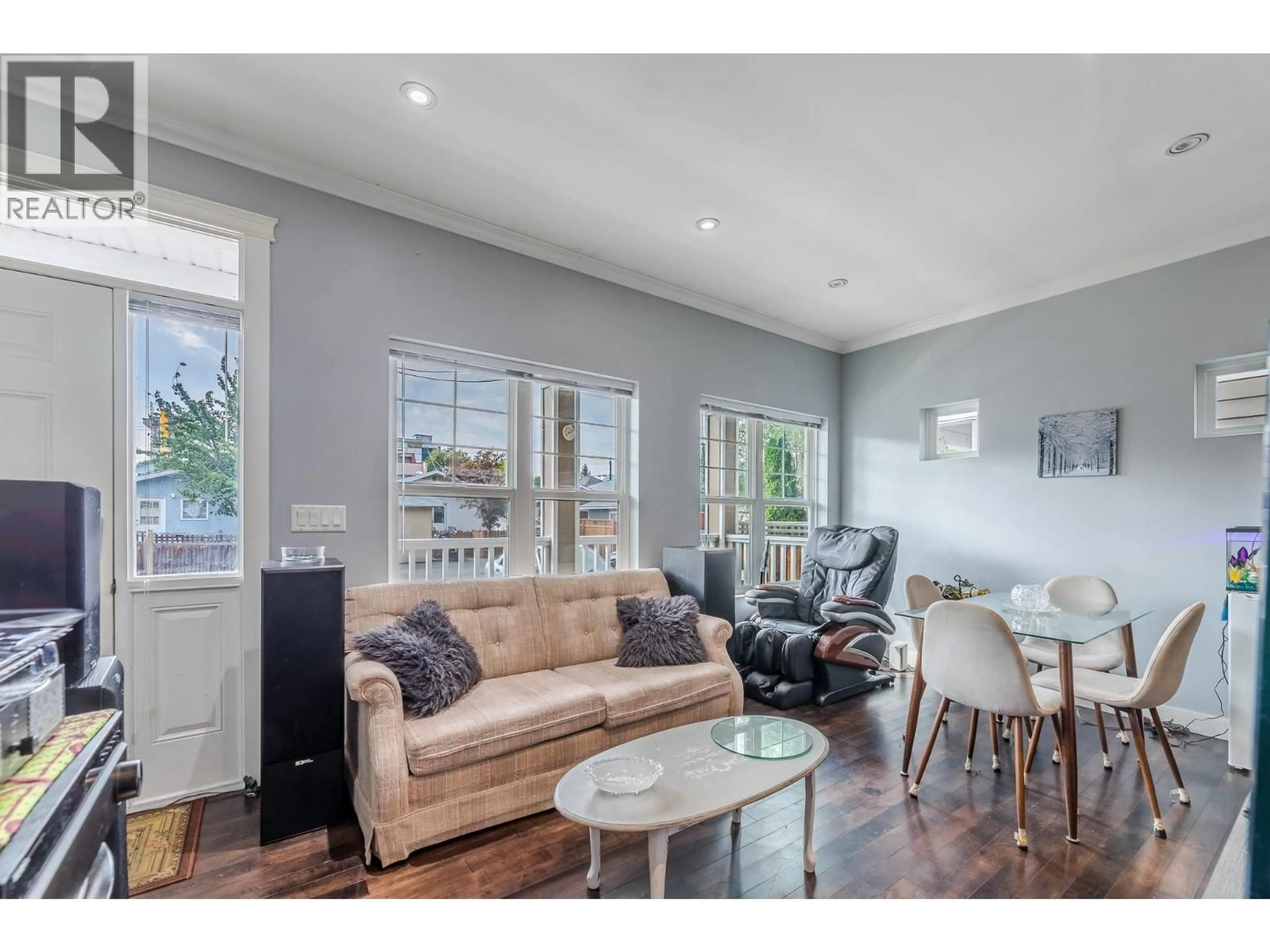 Living room with furniture, wood/laminate floor for 102 - 454 WESTMINSTER AVENUE WEST, Penticton British Columbia V2A1K5