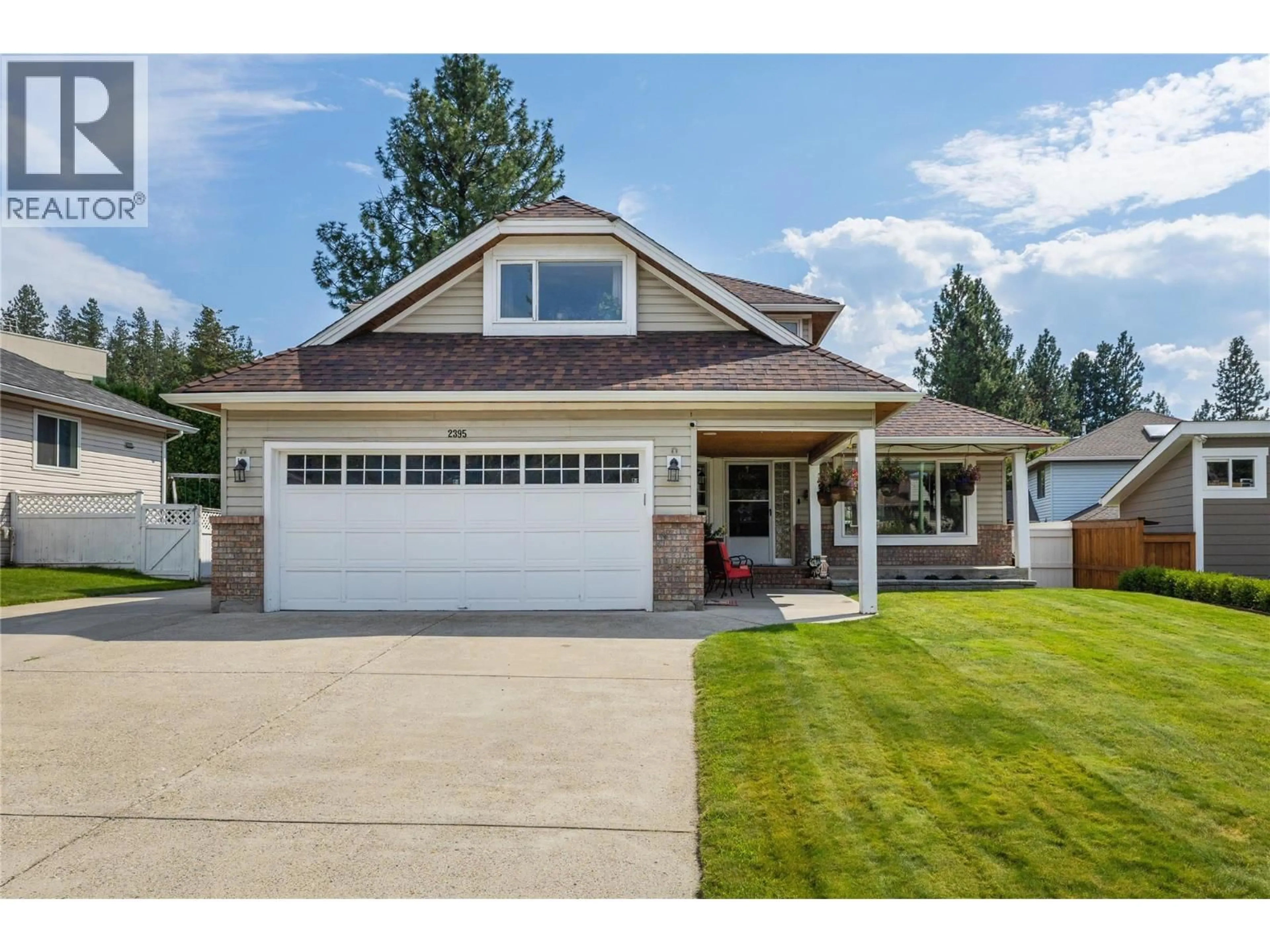 Home with vinyl exterior material, street for 2395 SHANNON RIDGE DRIVE, West Kelowna British Columbia V4T1T1