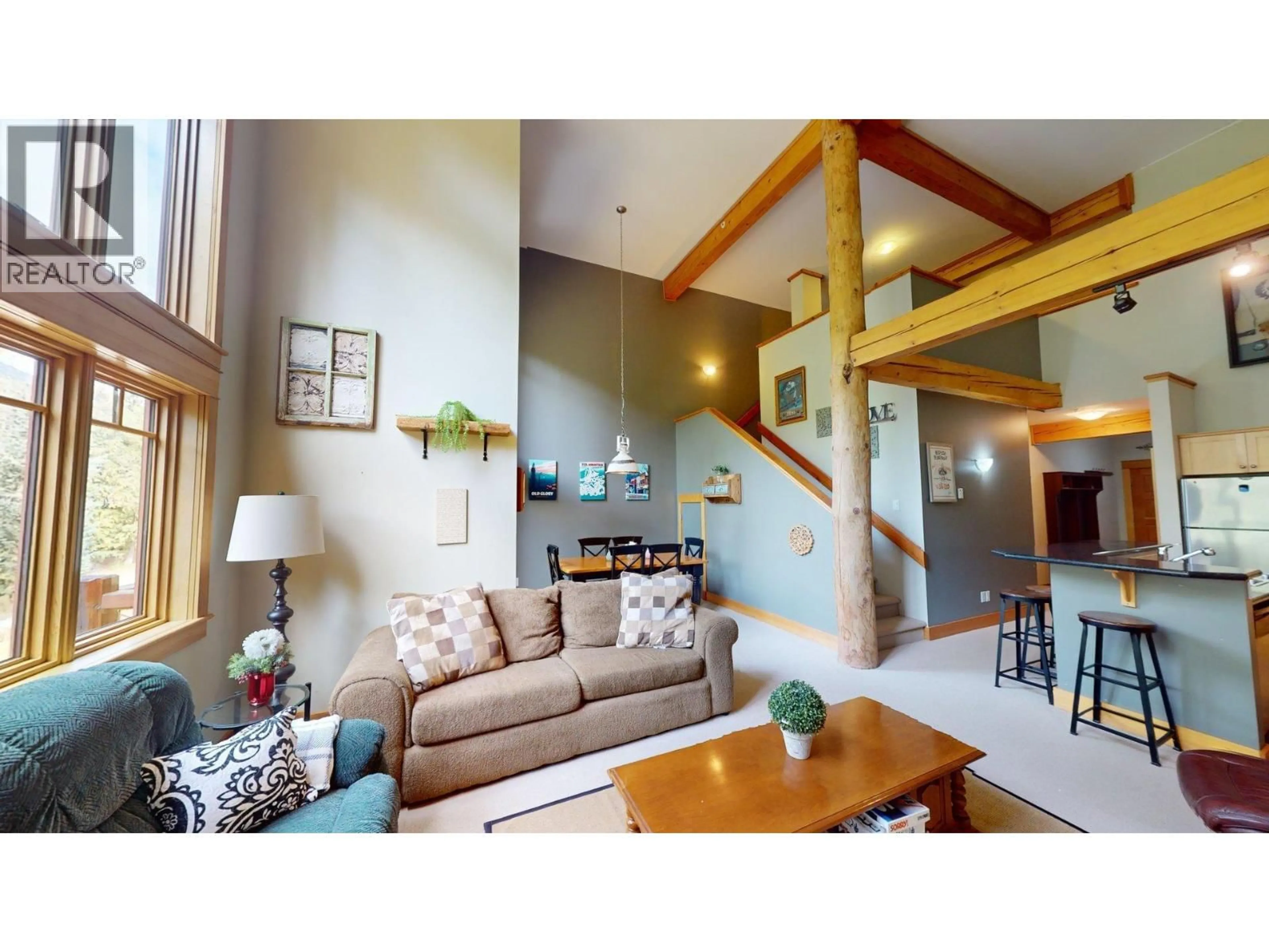 Living room with furniture, wood/laminate floor for 4D - 1005 MOUNTAIN VIEW ROAD, Rossland British Columbia V0G1Y0