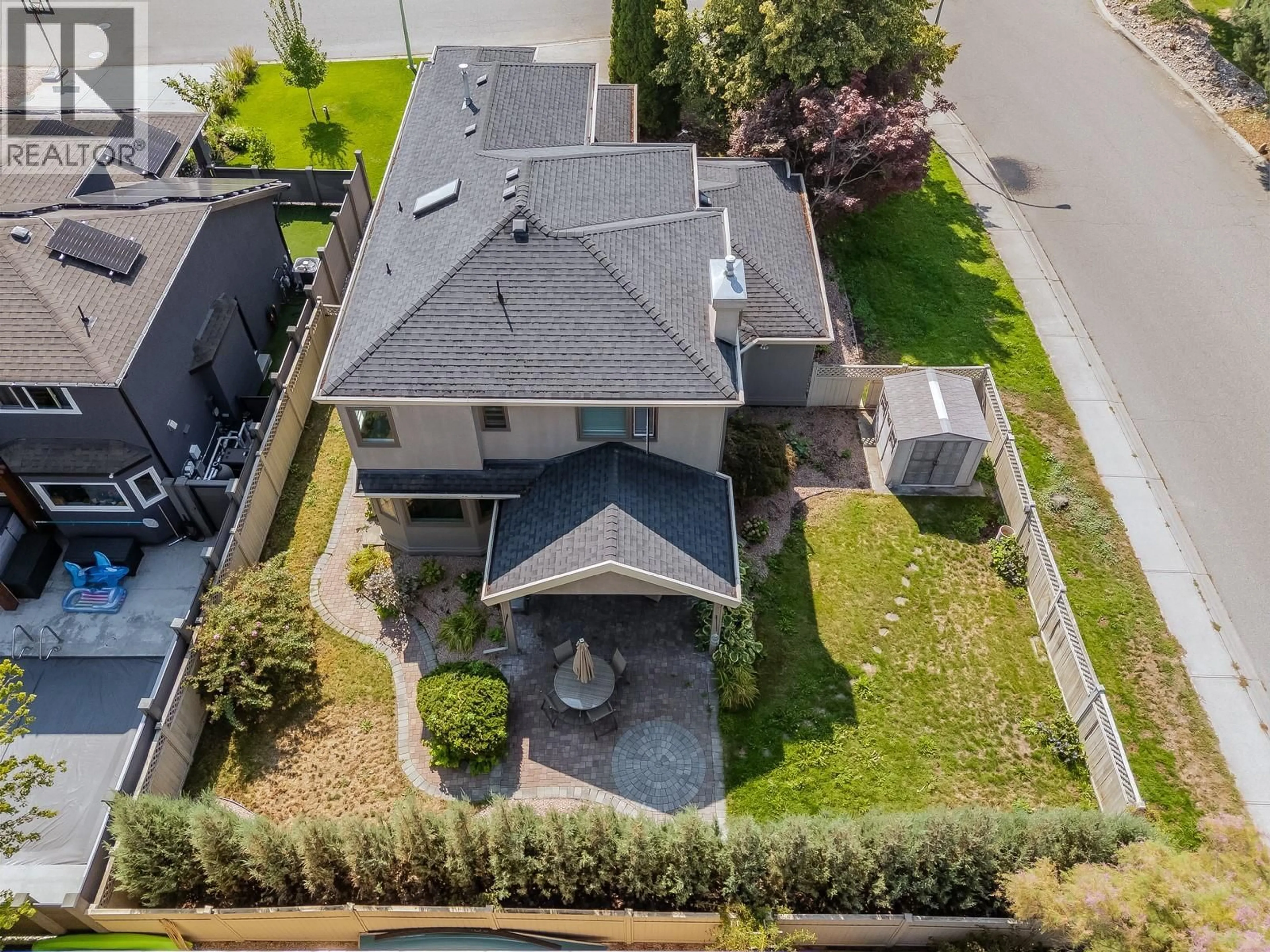 A pic from outside/outdoor area/front of a property/back of a property/a pic from drone, street for 844 MISSION SPRINGS CRESCENT, Kelowna British Columbia V1W3L9