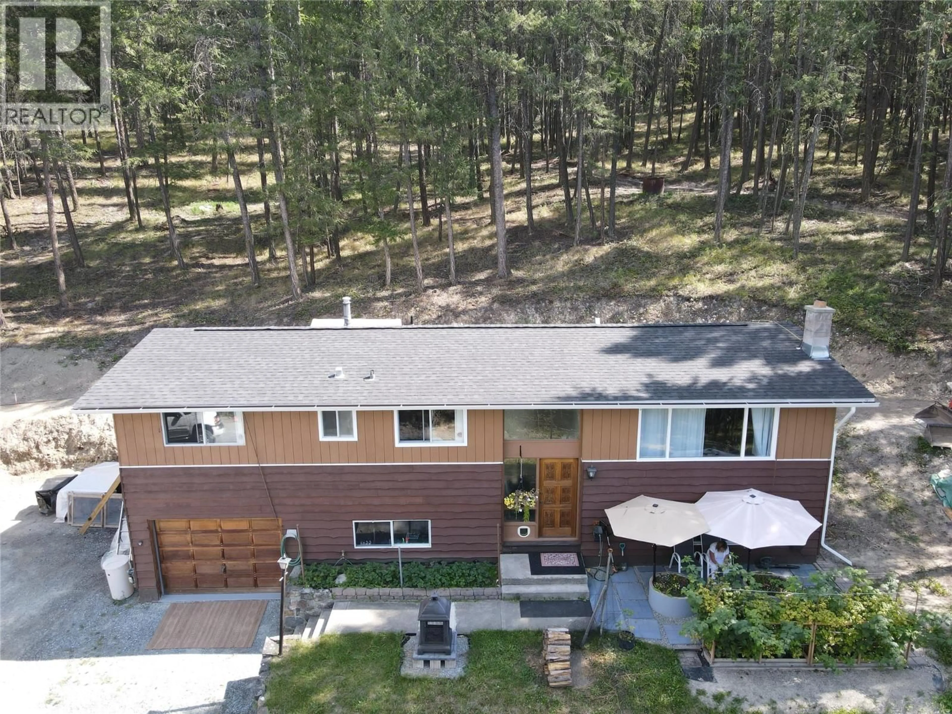 A pic from outside/outdoor area/front of a property/back of a property/a pic from drone, forest/trees view for 785 SILVER CREEK ROAD, Cranbrook British Columbia V1C5A2