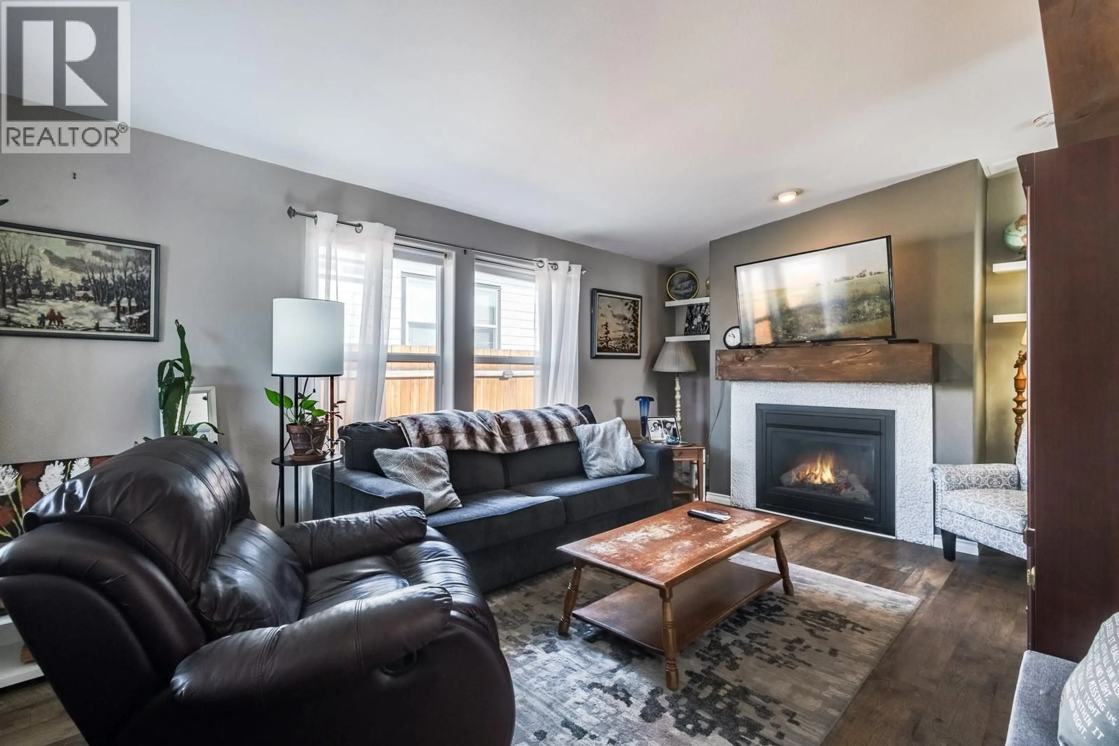 Living room with furniture, wood/laminate floor for 612 - 2440 OLD OKANAGAN HIGHWAY, Westbank British Columbia V4T1X6