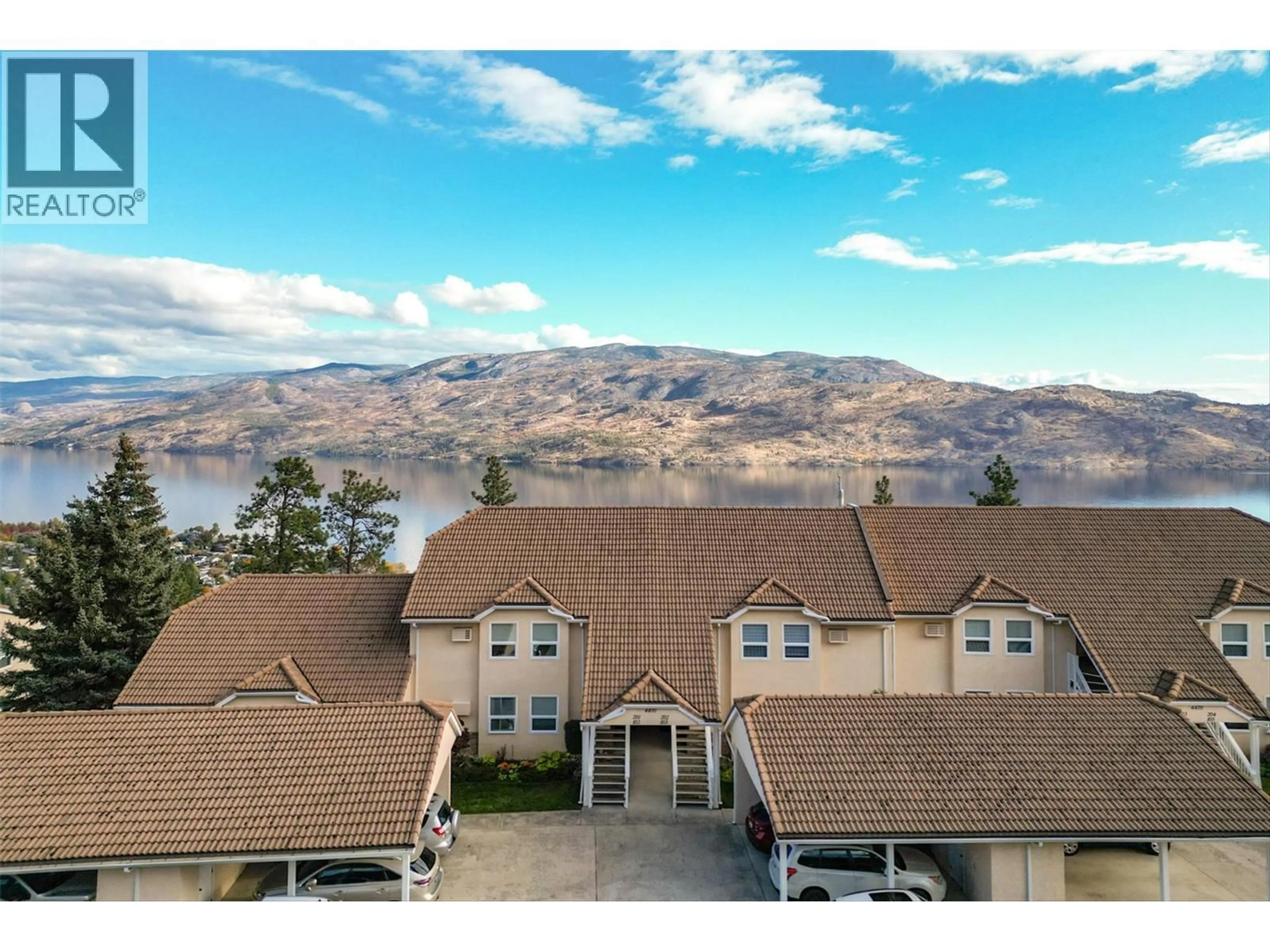 A pic from outside/outdoor area/front of a property/back of a property/a pic from drone, mountain view for 103 - 4470 PONDEROSA DRIVE, Peachland British Columbia V0H1X5
