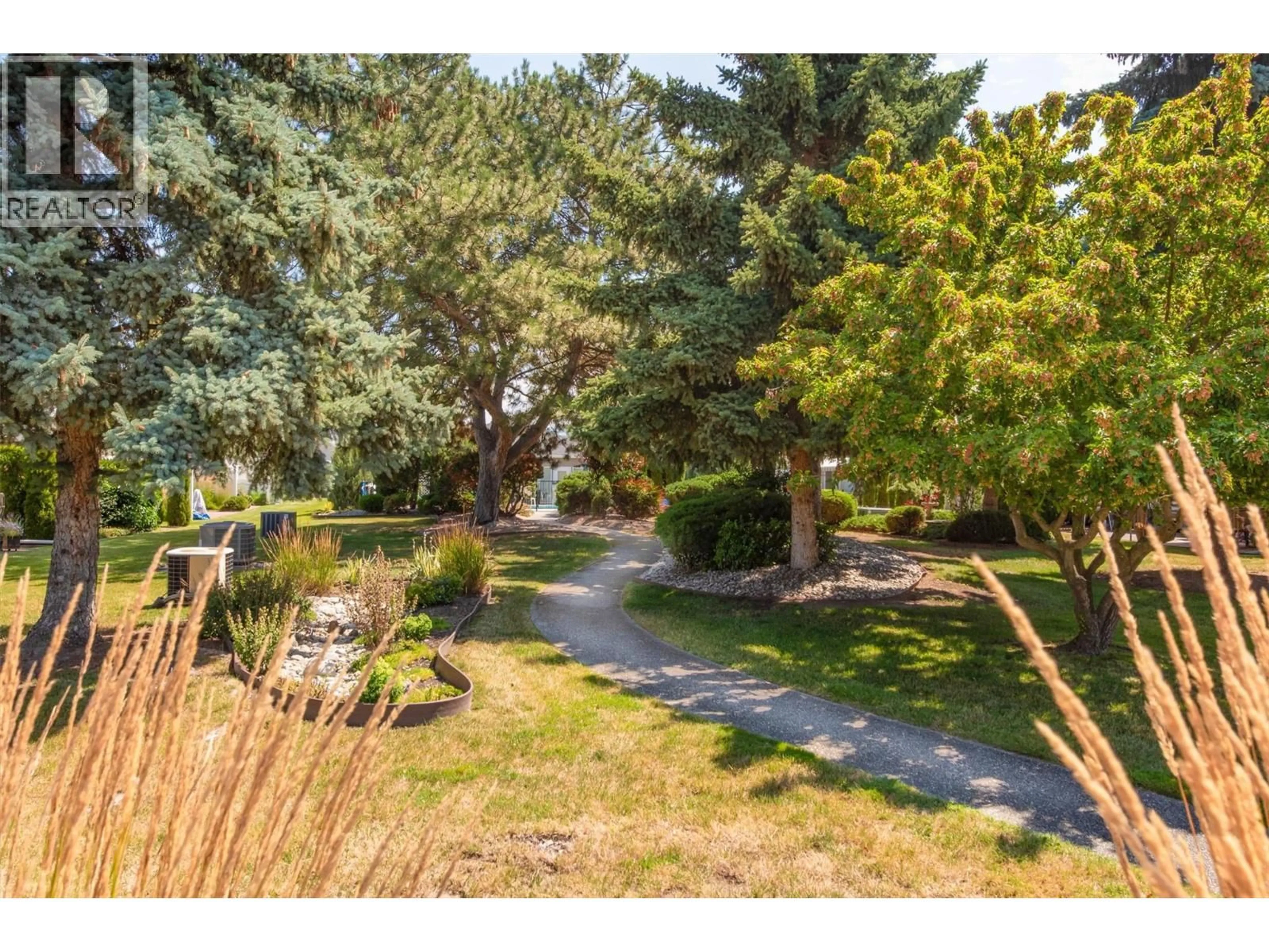 A pic from outside/outdoor area/front of a property/back of a property/a pic from drone, forest/trees view for 38 - 1020 LANFRANCO ROAD, Kelowna British Columbia V1W3W6