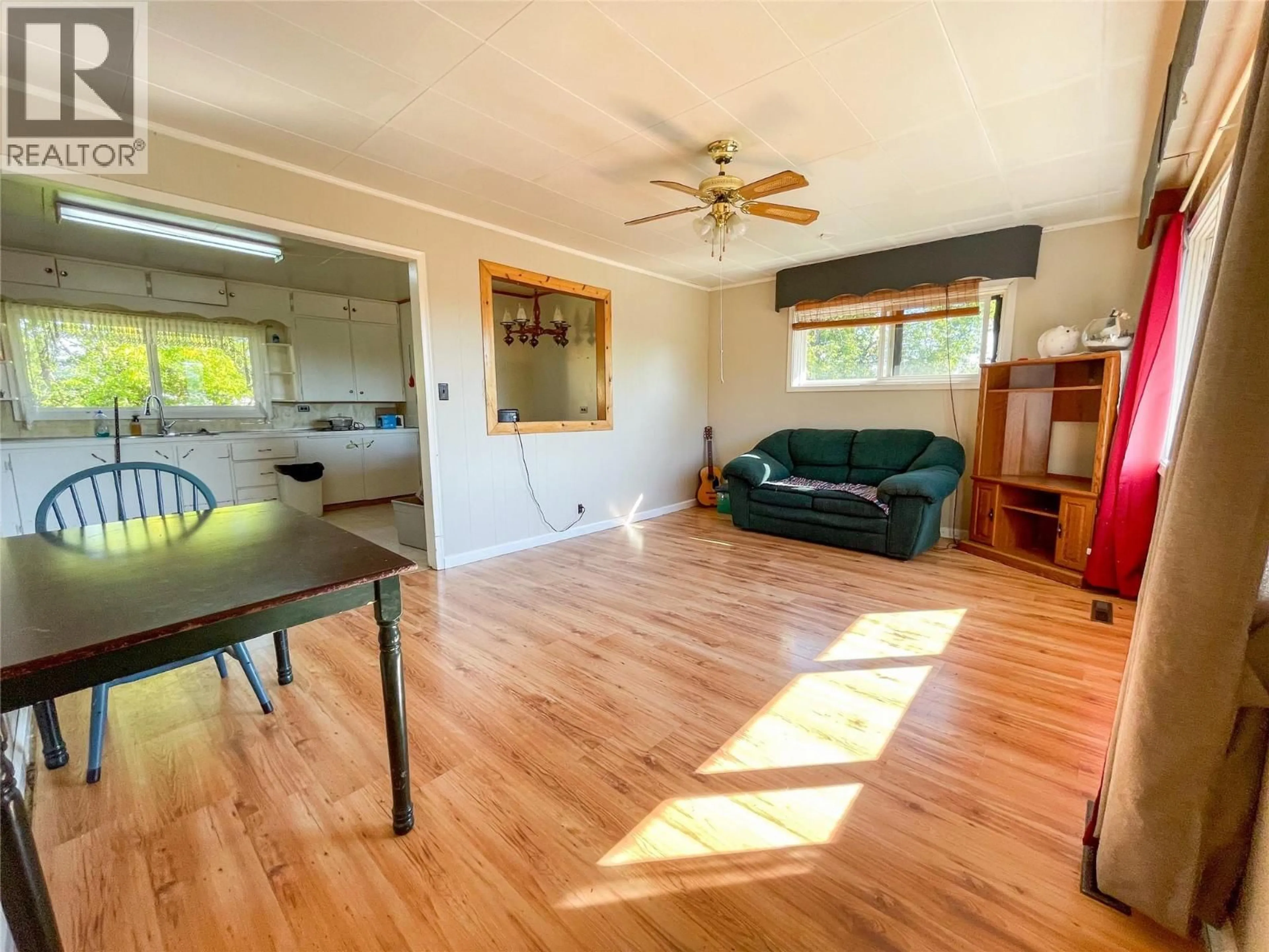 Living room with furniture, wood/laminate floor for 4810 48 AVENUE, Pouce Coupe British Columbia V0C2C0