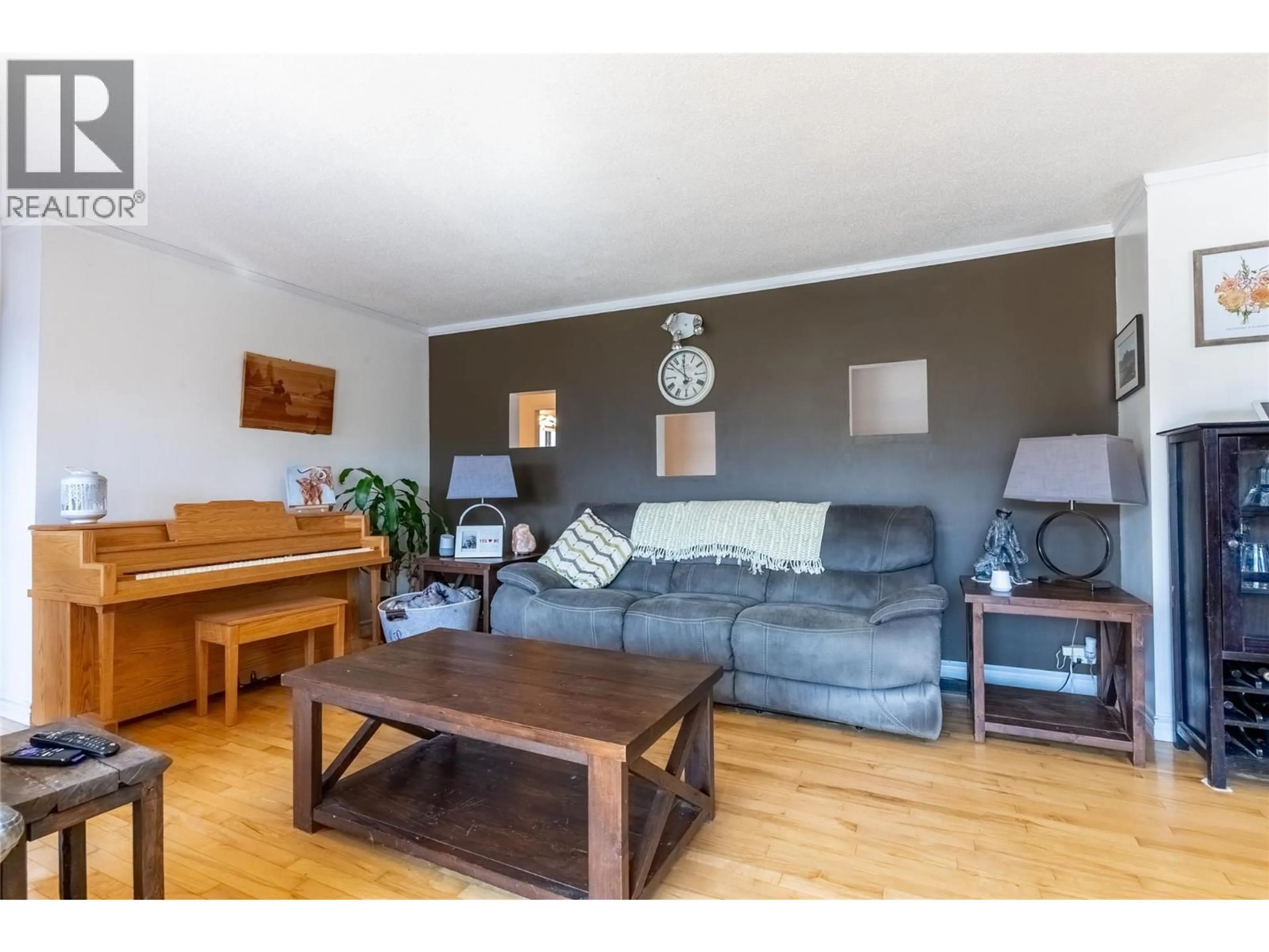 Living room with furniture, wood/laminate floor for 1854 FLEETWOOD AVENUE, Kamloops British Columbia V2B4S1