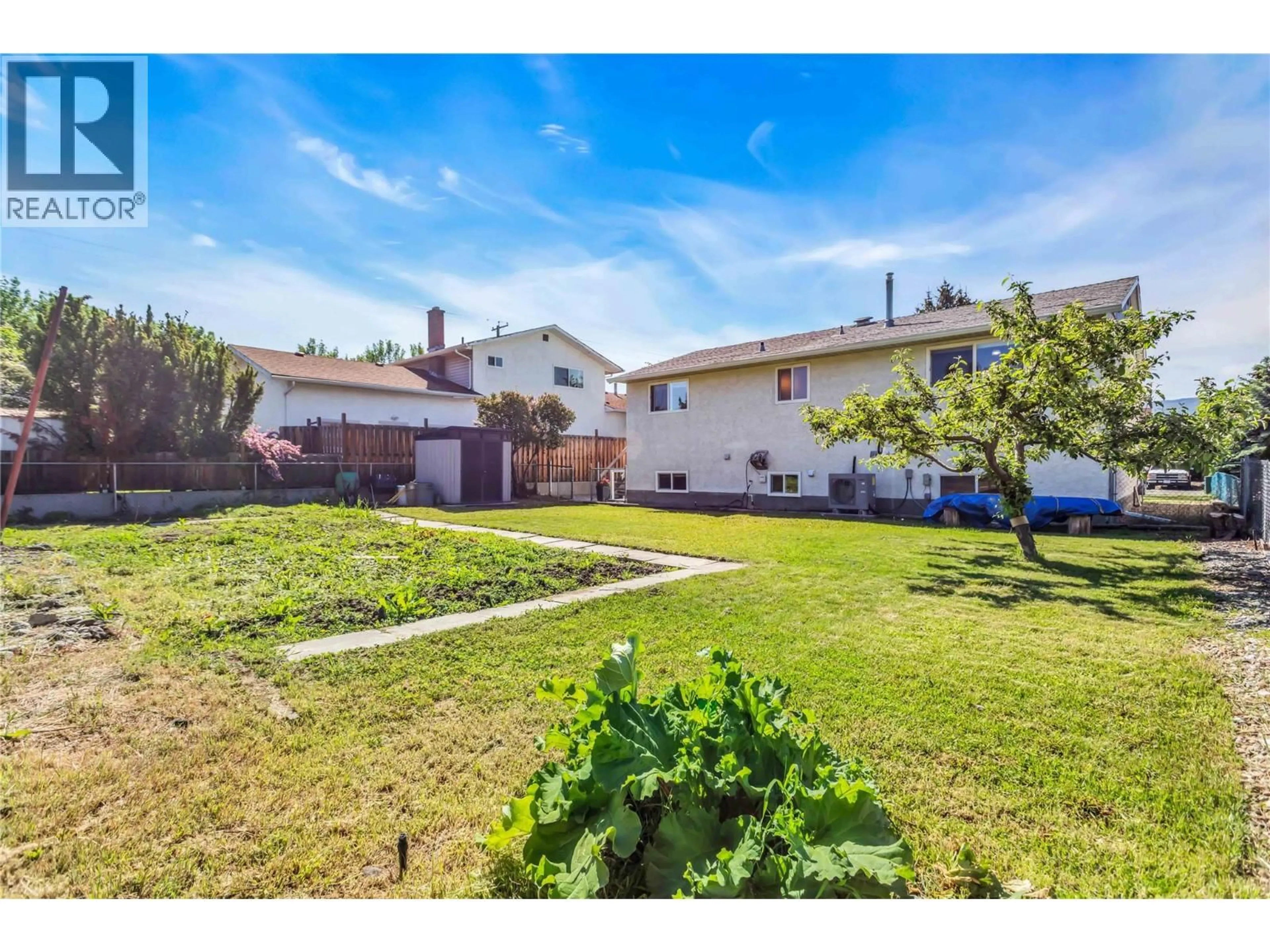 A pic from outside/outdoor area/front of a property/back of a property/a pic from drone, street for 1480 DENVER ROAD, Kelowna British Columbia V1Y8C2