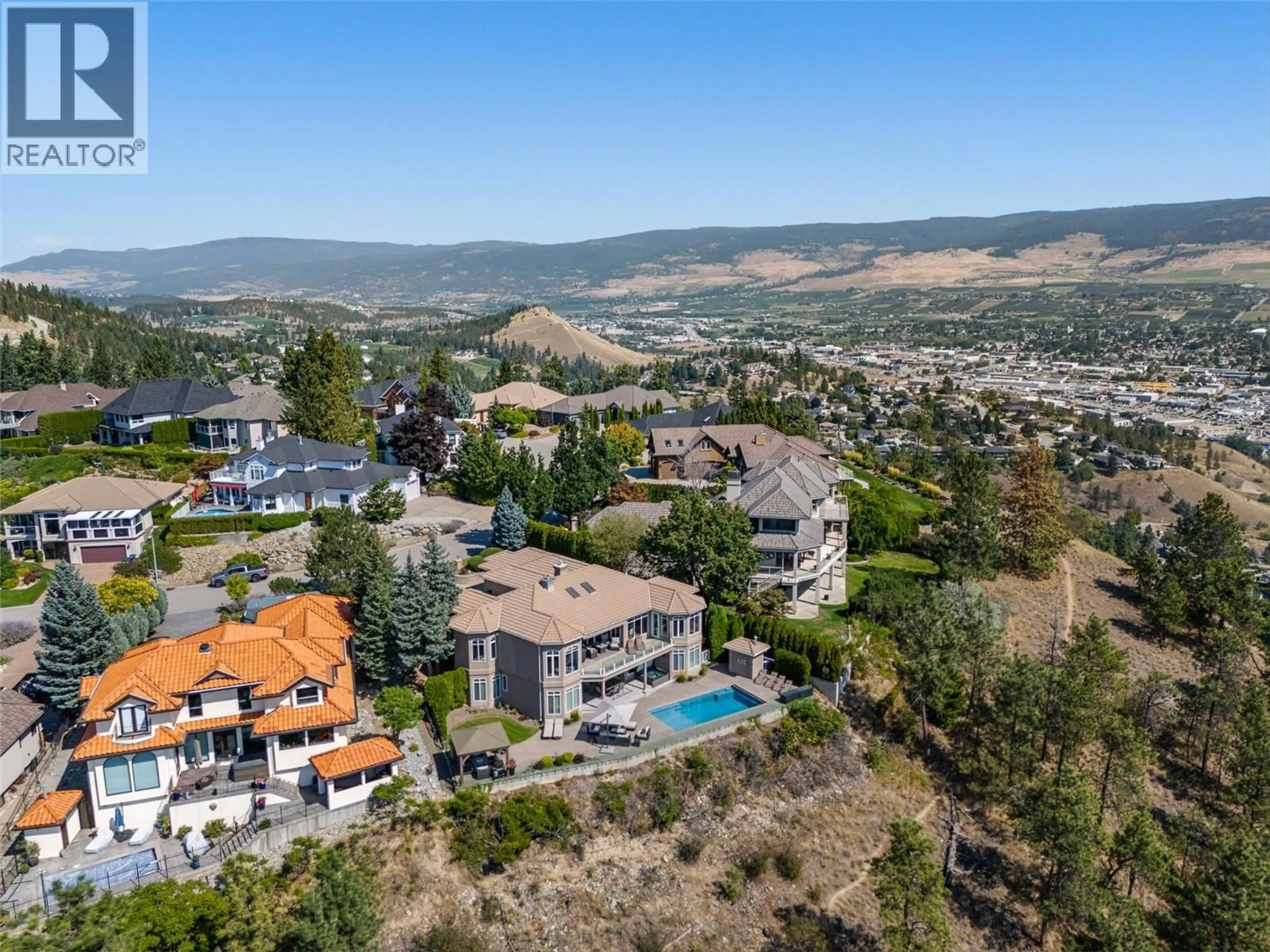 A pic from outside/outdoor area/front of a property/back of a property/a pic from drone, mountain view for 994 SKEENA DRIVE, Kelowna British Columbia V1V2K7