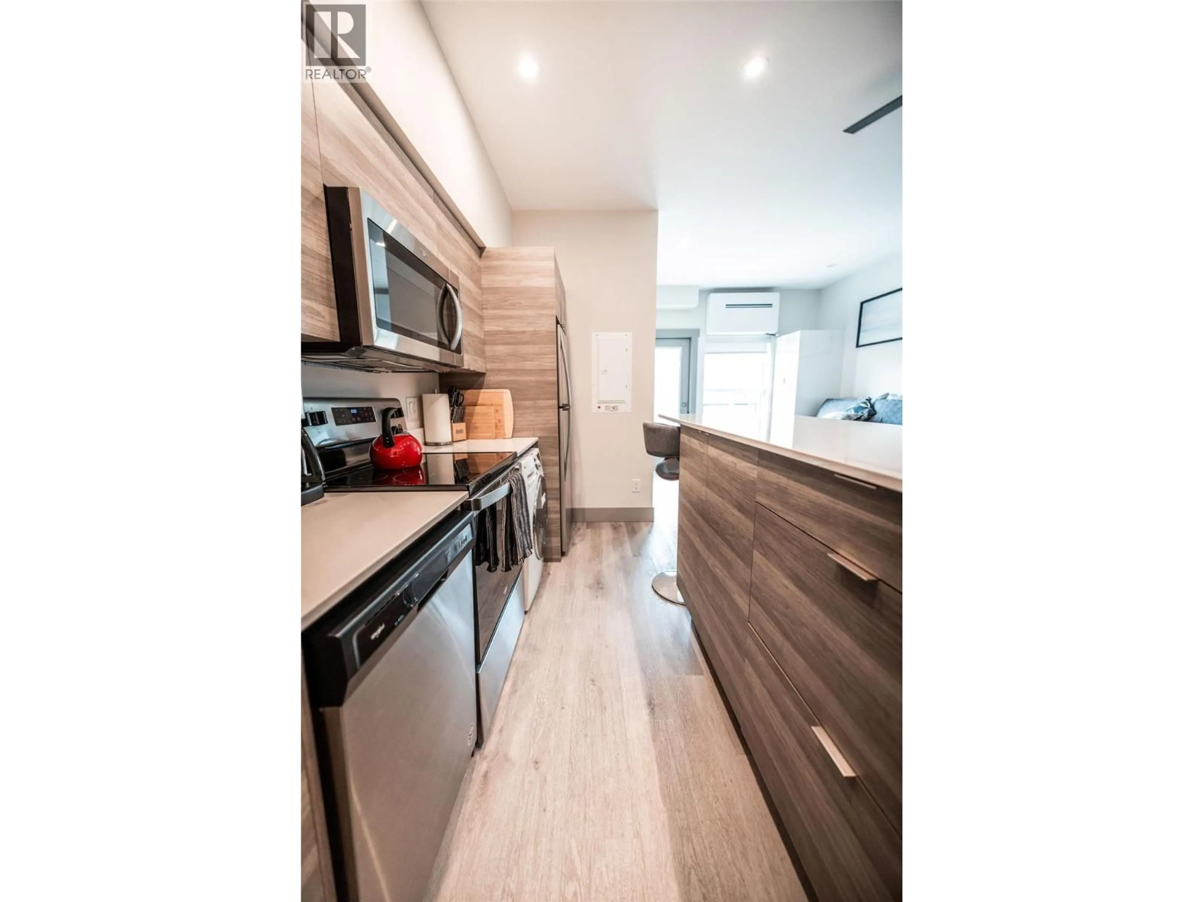 Open concept kitchen, wood/laminate floor for 518 - 2555 LAKESHORE ROAD, Vernon British Columbia V1H0A4
