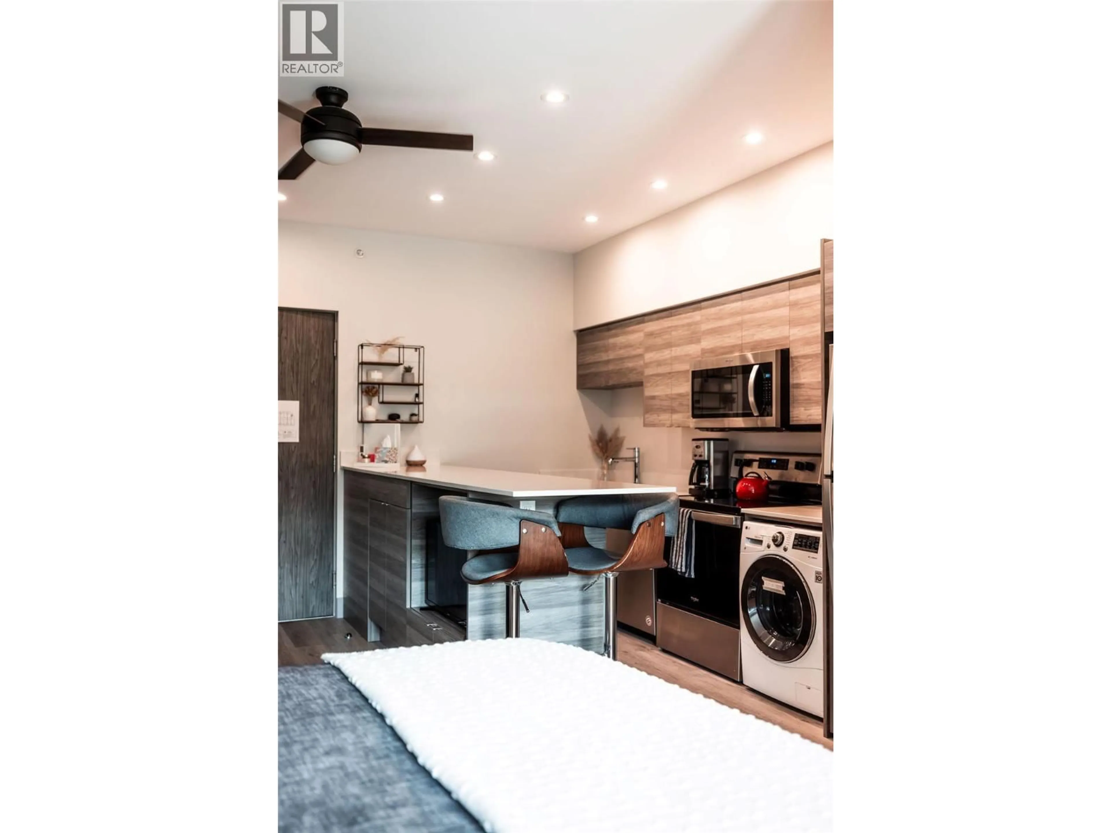 Open concept kitchen, wood/laminate floor for 518 - 2555 LAKESHORE ROAD, Vernon British Columbia V1H0A4