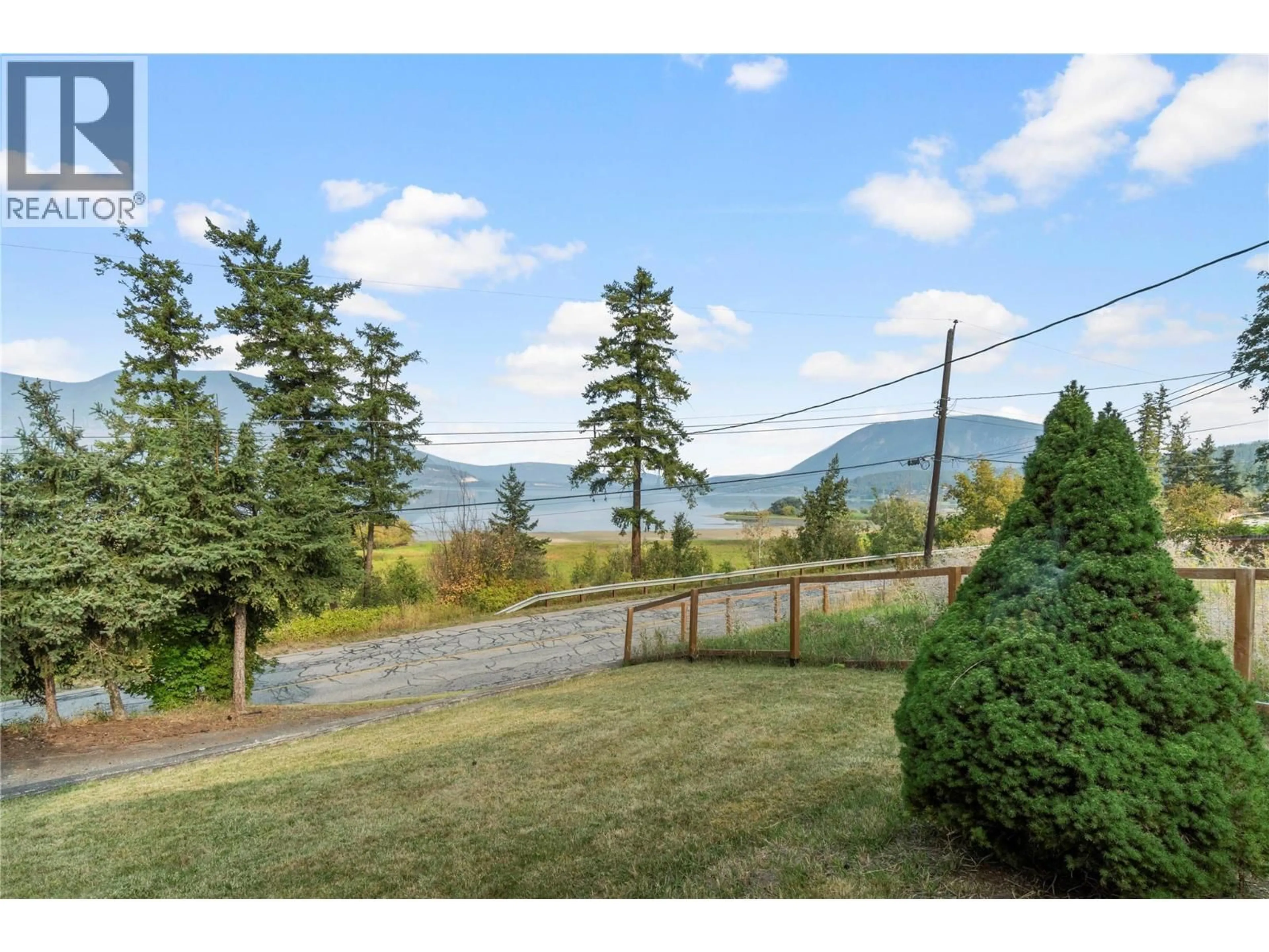 A pic from outside/outdoor area/front of a property/back of a property/a pic from drone, mountain view for 1160 LAKESHORE ROAD NORTHEAST, Salmon Arm British Columbia V1E2V7