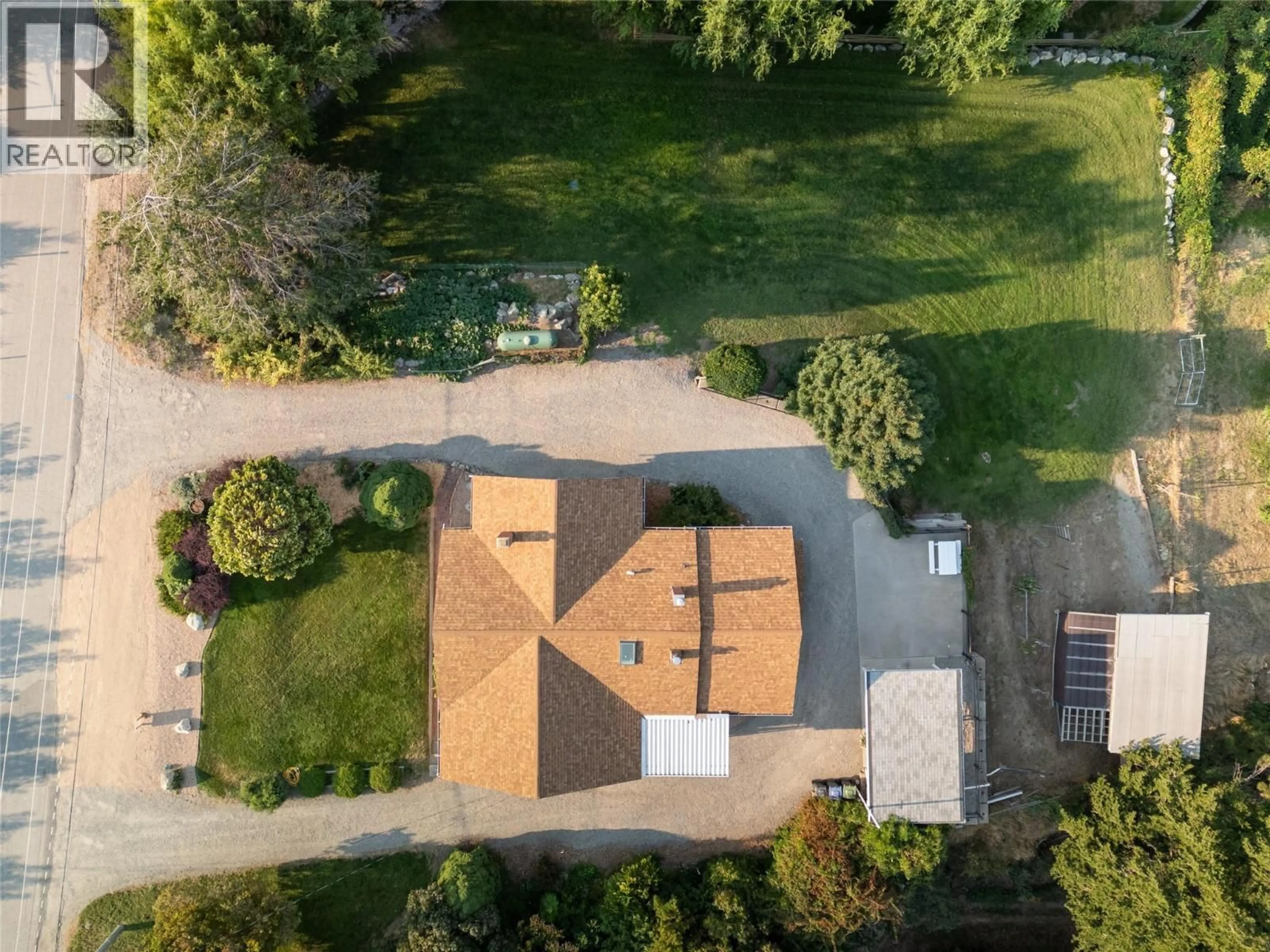 A pic from outside/outdoor area/front of a property/back of a property/a pic from drone, street for 3045 VALLEYVIEW ROAD, Penticton British Columbia V2A8W8