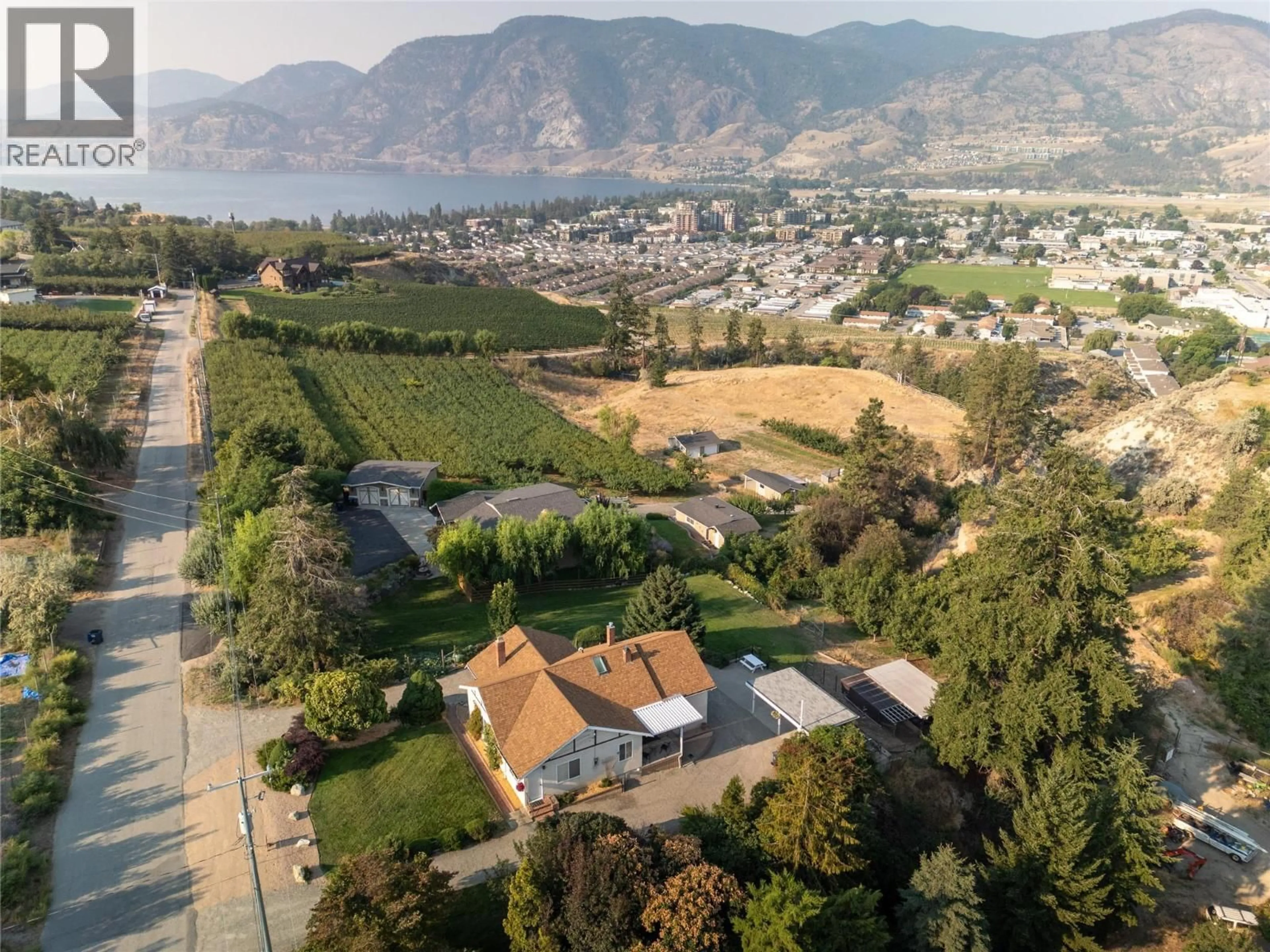 A pic from outside/outdoor area/front of a property/back of a property/a pic from drone, mountain view for 3045 VALLEYVIEW ROAD, Penticton British Columbia V2A8W8