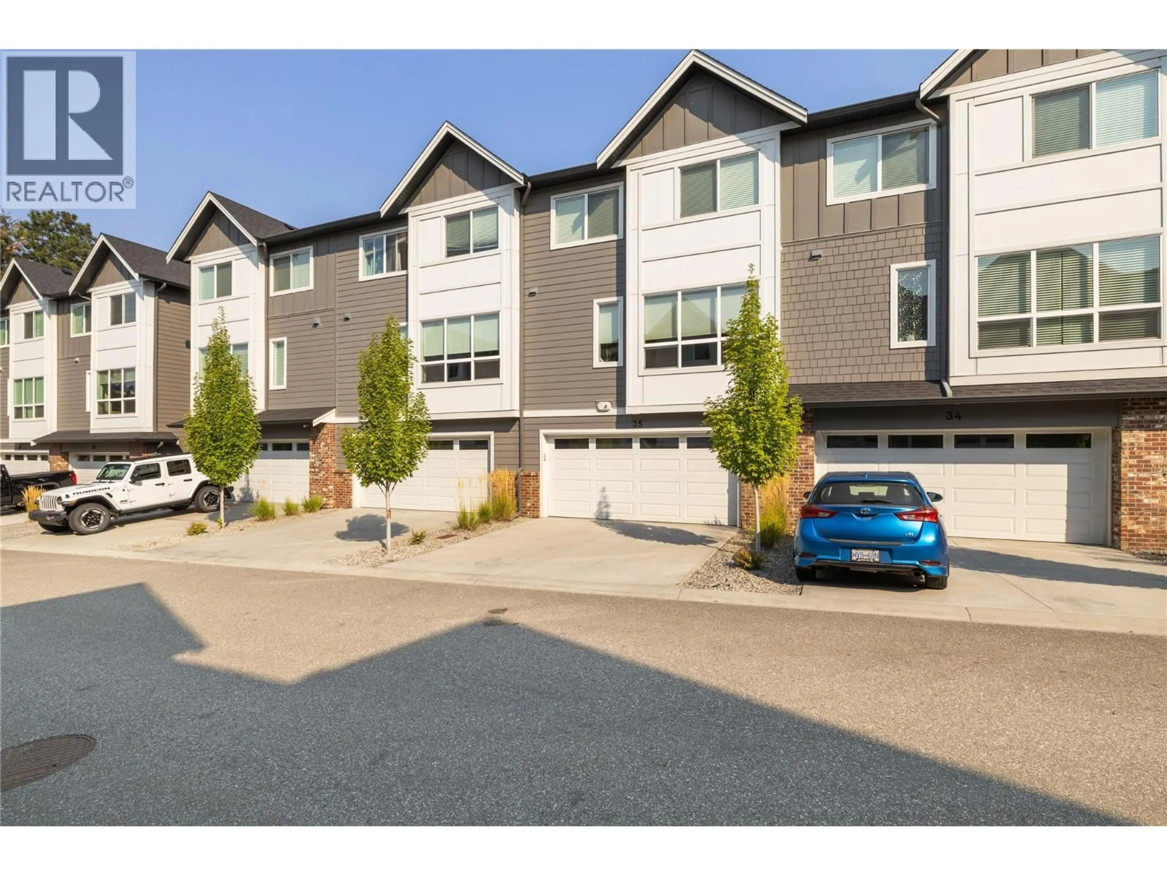 A pic from outside/outdoor area/front of a property/back of a property/a pic from drone, street for 35 - 12075 OCEOLA ROAD, Lake Country British Columbia V4V0A7